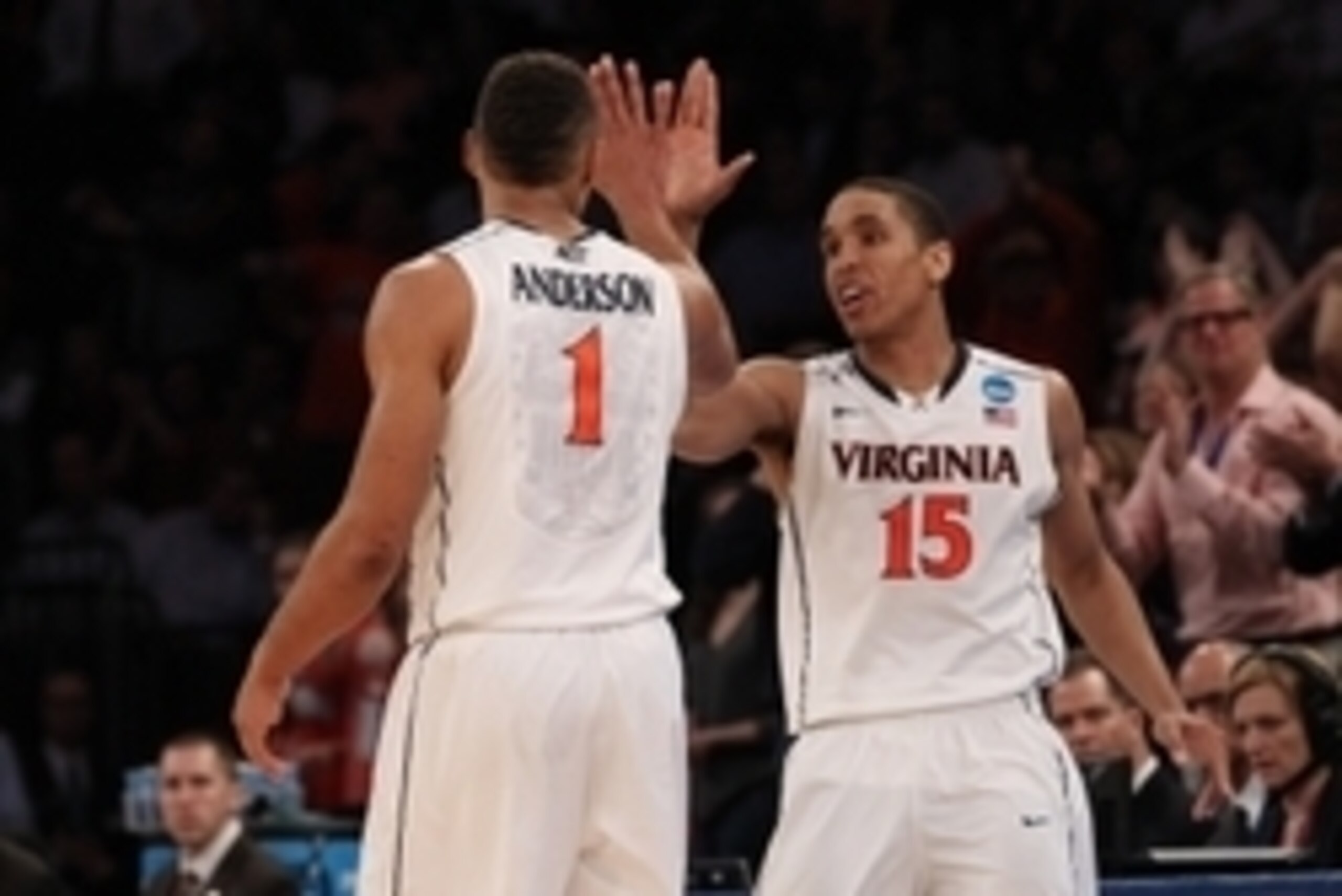 Mar 28, 2014; New York, NY, USA; Virginia Cavaliers guard Malcolm Brogdon (15) celebrates with Virginia Cavaliers guard Justin Anderson (1) during the second half in the semifinals of the east regional of the 2014 NCAA Mens Basketball Championship tournam
