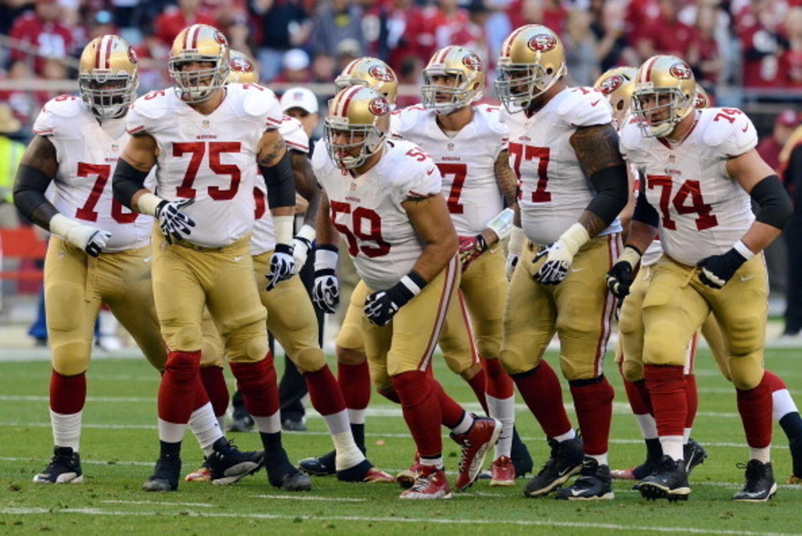 GLENDALE, AZ - DECEMBER 29:  Anthony Davis #76, Alex Boone #75, Jonathan Goodwin #59, Mike Iupati #77, Joe Staley #74 and Colin Kaepernick #7 of the San Francisco 49ers run up to the line of scrimmage against the Arizona Cardinals at University of Phoenix