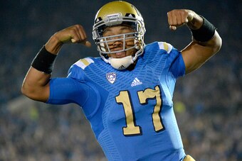 PASADENA, CA - NOVEMBER 22:  Brett Hundley #17 of the UCLA Bruins celebrates his run for a touchdown for a 38-14 lead over the USC Trojans during the third quarter at the Rose Bowl on November 22, 2014 in Pasadena, California. UCLA won 38-14.  (Photo by H