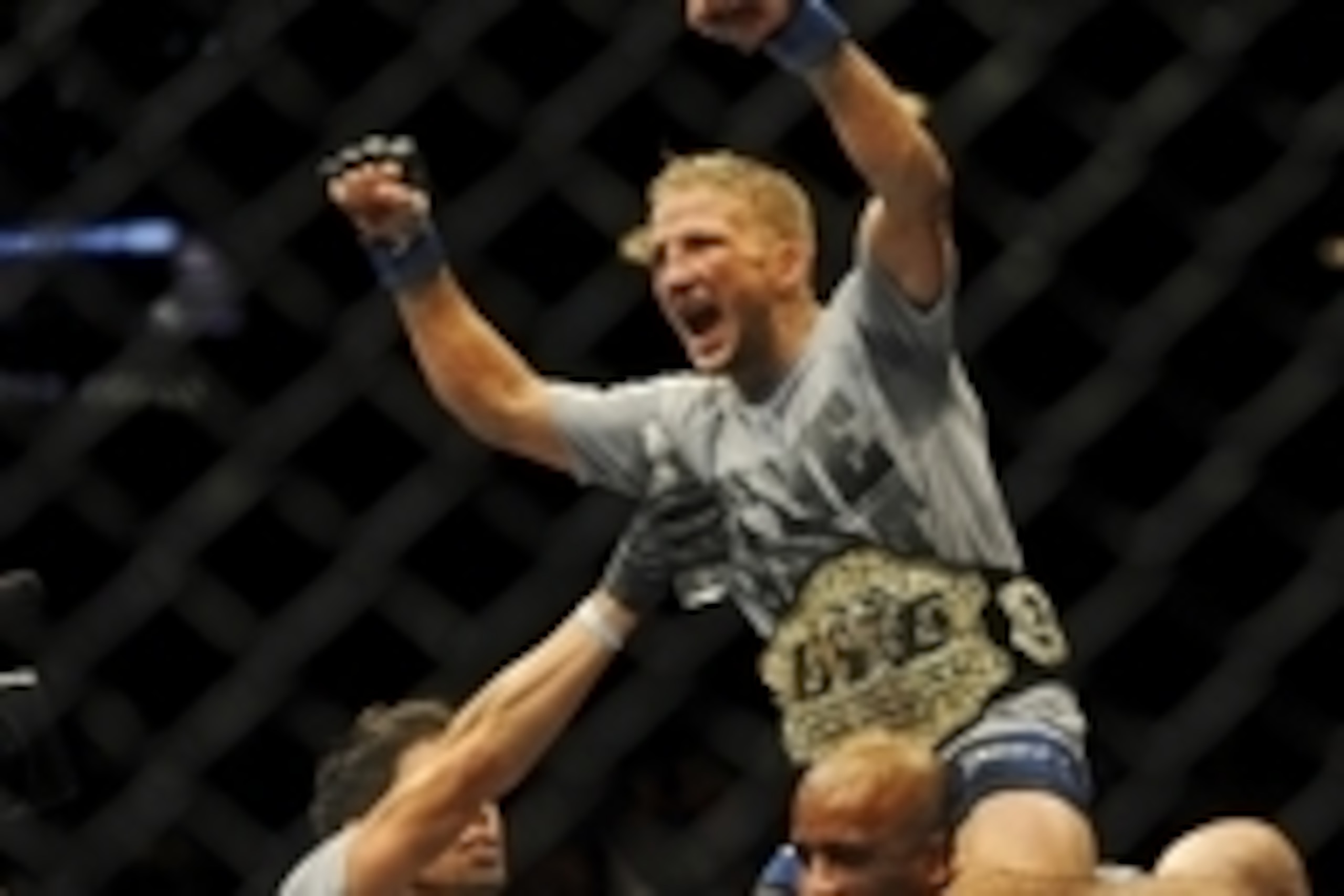 May 24, 2014; Las Vegas, NV, USA; New bantamweight champion TJ Dillashaw celebrates his TKO win over opponent  Renan Barao (not pictured) following their UFC 173 bantamweight championship bout at MGM Grand Garden Arena. Mandatory Credit: Stephen R. Sylvan