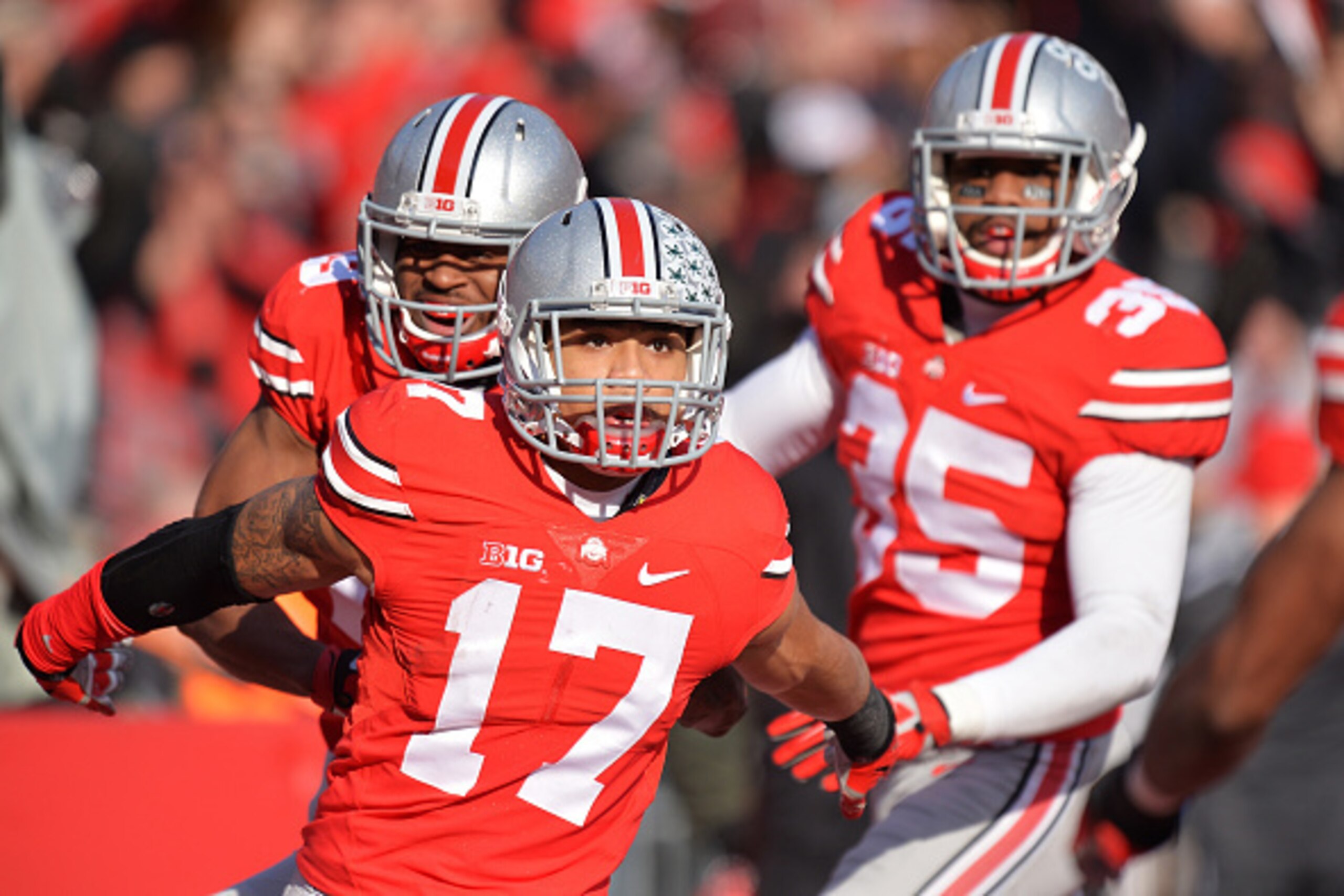 COLUMBUS, OH - NOVEMBER 22:  Jalin Marshall #17 of the Ohio State Buckeyes celebrates after his 54-yard punt return for a touchdown in the third quarter against the Indiana Hoosiers at Ohio Stadium on November 22, 2014 in Columbus, Ohio. Marshall scored f