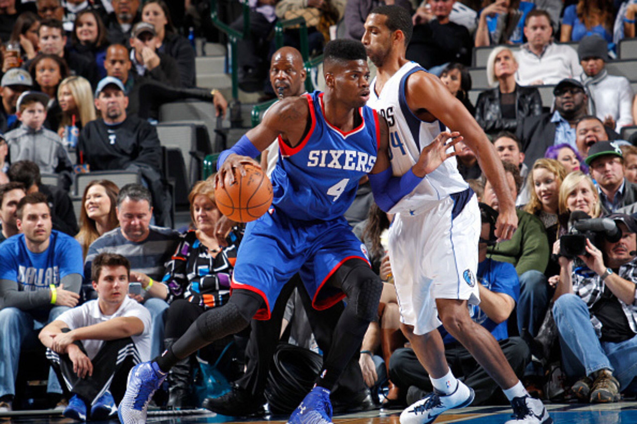 DALLAS, TX - NOVEMBER 13: Nerlens Noel #4 of the Philadelphia 76ers posts up against Brandan Wright #34 of the Dallas Mavericks on November 13, 2014 at the American Airlines Center in Dallas, Texas. NOTE TO USER: User expressly acknowledges and agrees tha