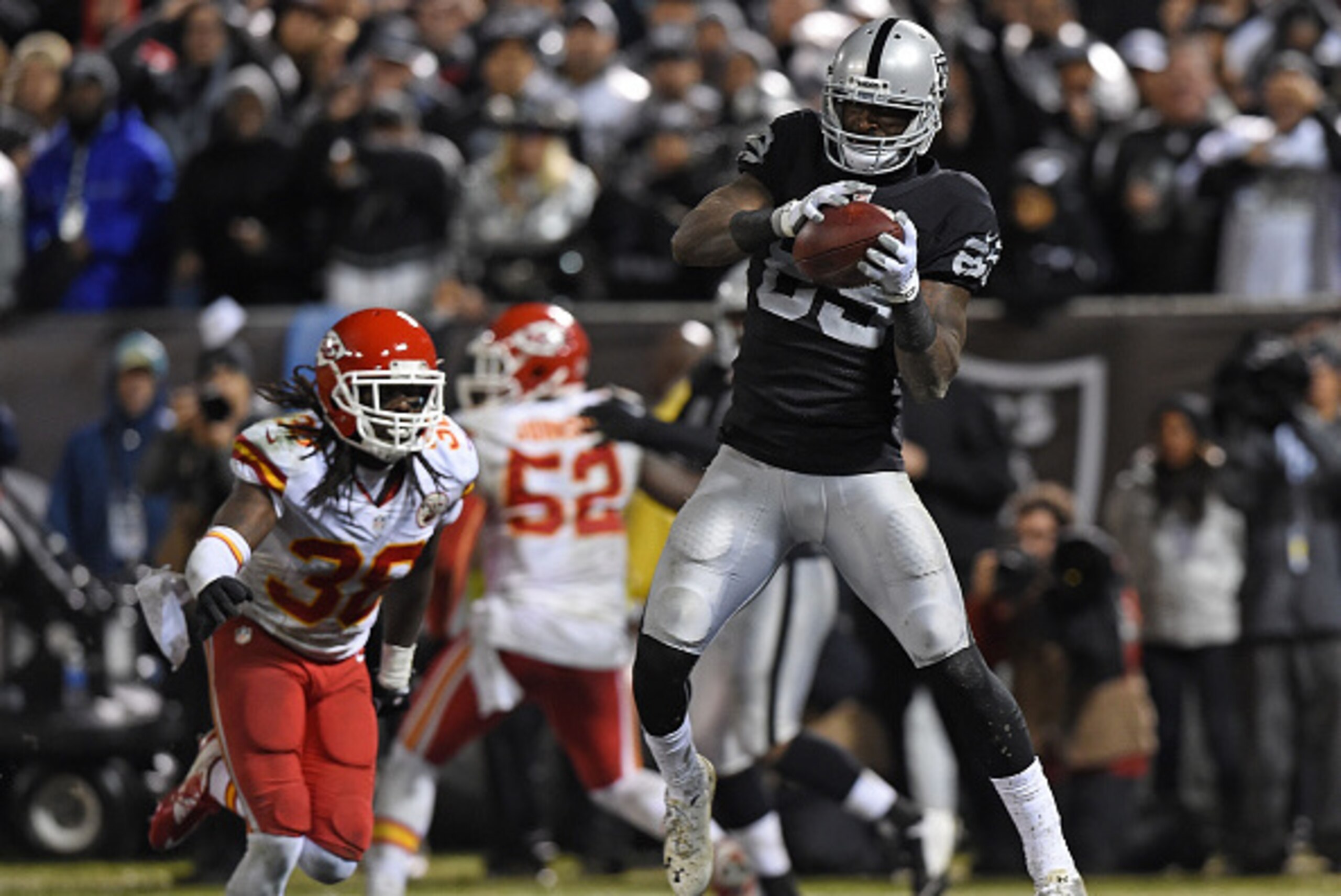 OAKLAND, CA - NOVEMBER 20:  James Jones #89 of the Oakland Raiders catches the ball for a touchdown as Ron Parker #38 of the Kansas City Chiefs defends in the fourth quarter of the game at O.co Coliseum on November 20, 2014 in Oakland, California.  (Photo