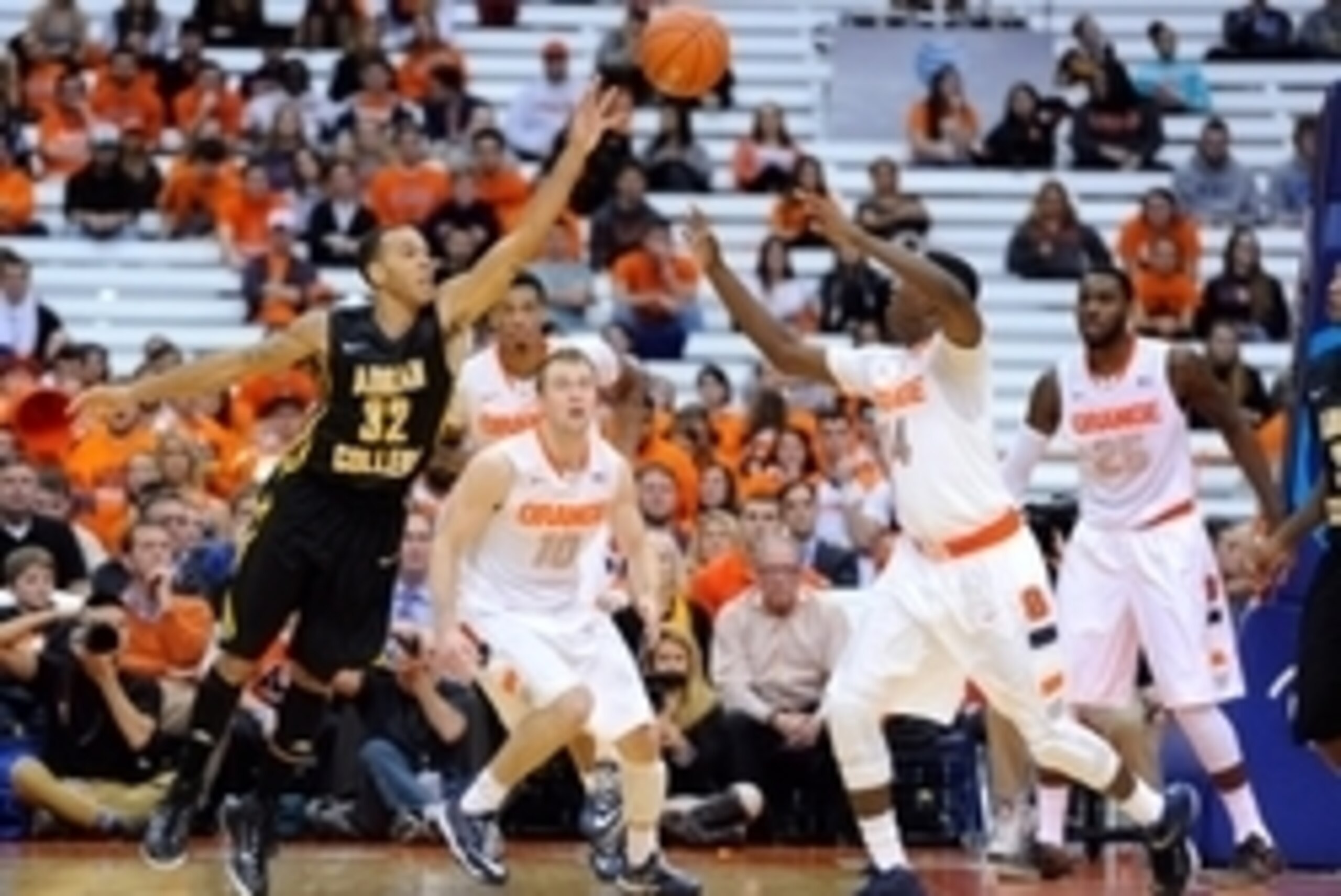 Nov 10, 2014; Syracuse, NY, USA; Adrian Bulldogs guard R'mand Harp (32) and Syracuse Orange guard Kaleb Joseph (14) battle for a loose ball during the first half at the Carrier Dome.  Mandatory Credit: Rich Barnes-USA TODAY Sports