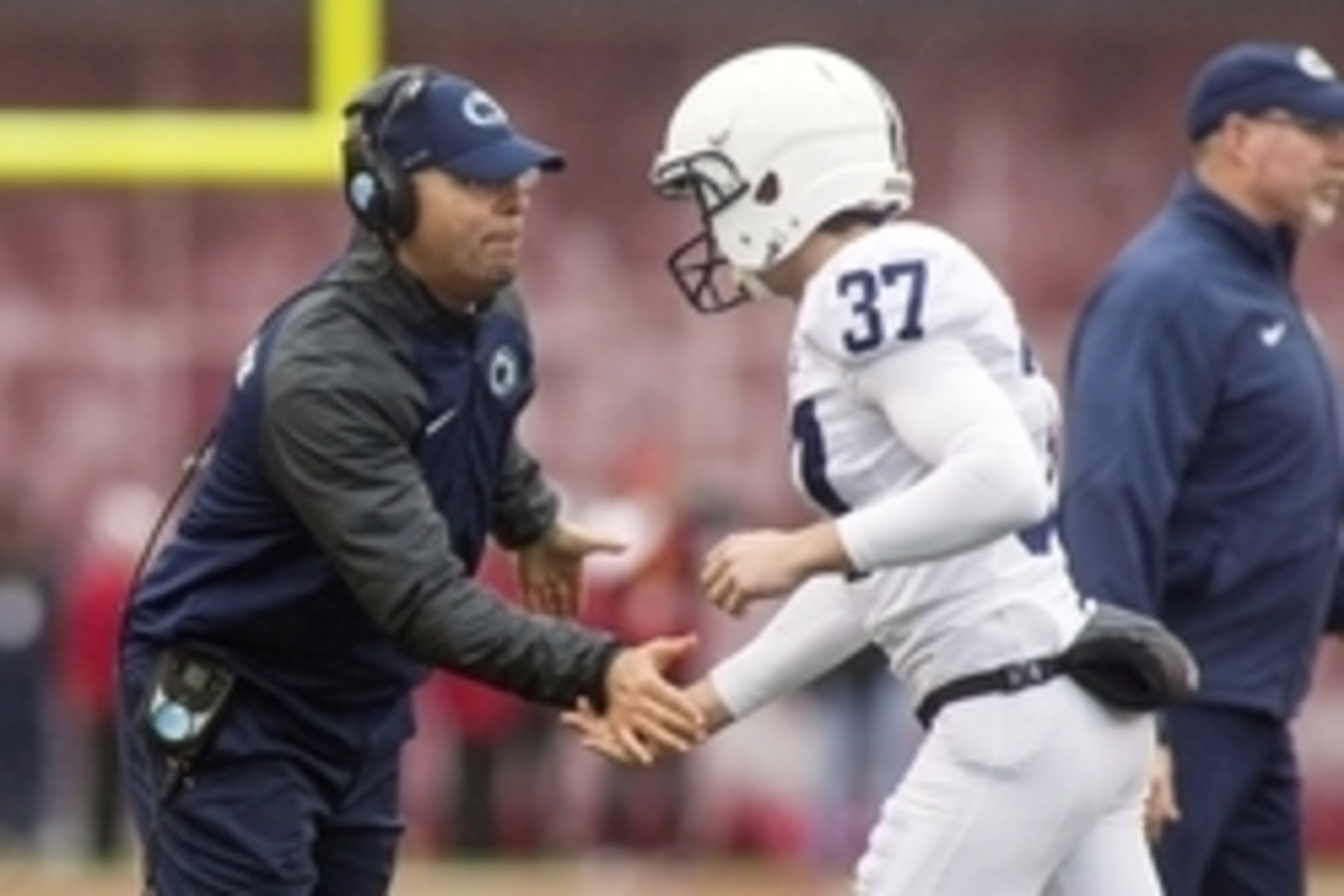 Nov 8, 2014; Bloomington, IN, USA; Penn State Nittany Lions head coach James Franklin congratulates  place kicker Chris Gulla (37) after he makes a field in the fourth quarter against the Indiana Hoosiers at Memorial Stadium. Penn State Nittany Lions beat