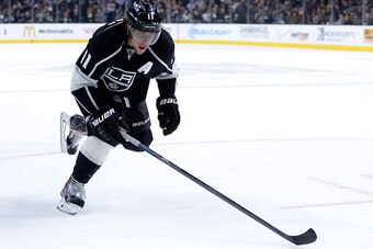 LOS ANGELES, CA - NOVEMBER 20:  Anze Kopitar #11 of the Los Angeles Kings forechecks against the Carolina Hurricanes at Staples Center on November 20, 2014 in Los Angeles, California.  (Photo by Harry How/Getty Images)