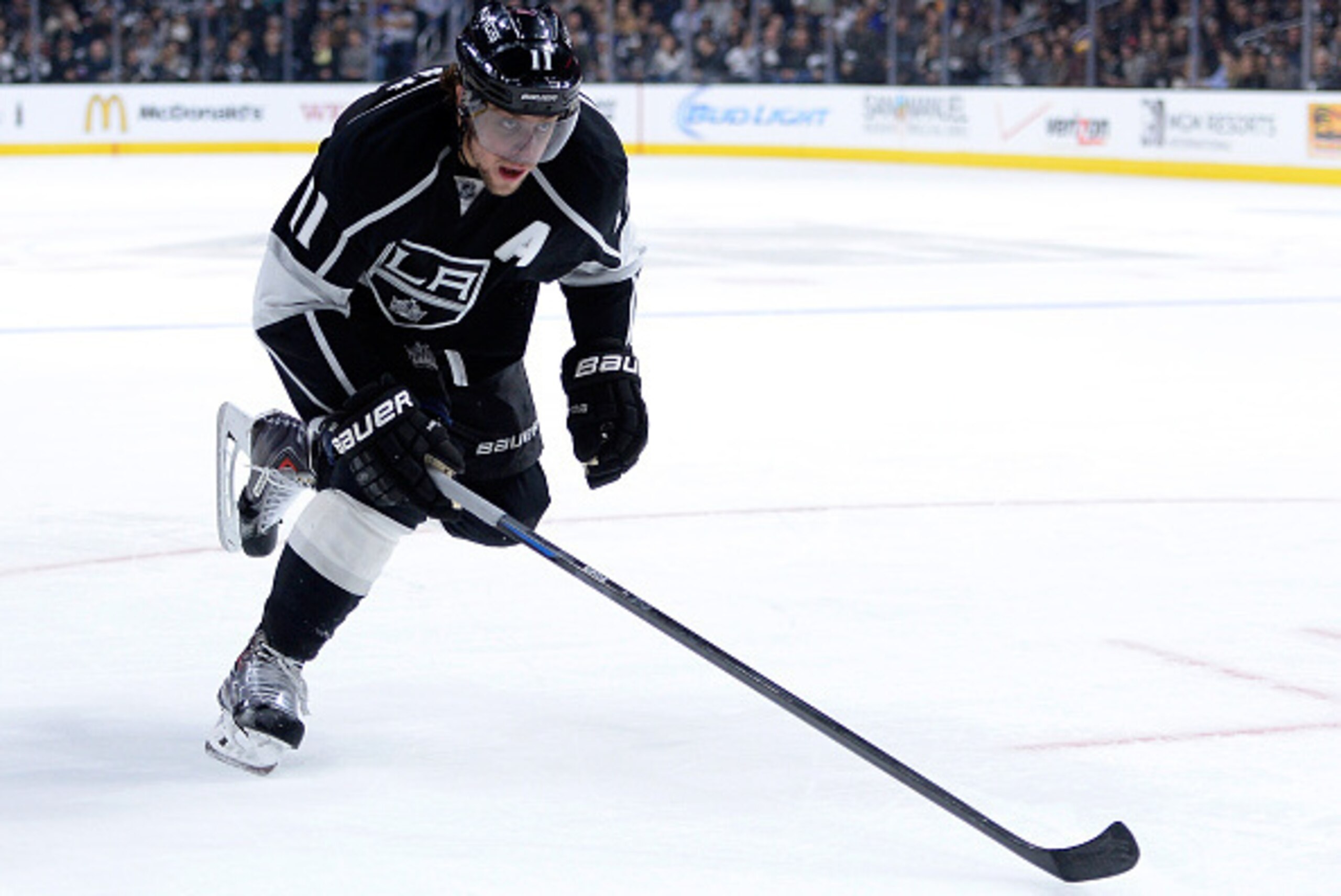 LOS ANGELES, CA - NOVEMBER 20:  Anze Kopitar #11 of the Los Angeles Kings forechecks against the Carolina Hurricanes at Staples Center on November 20, 2014 in Los Angeles, California.  (Photo by Harry How/Getty Images)