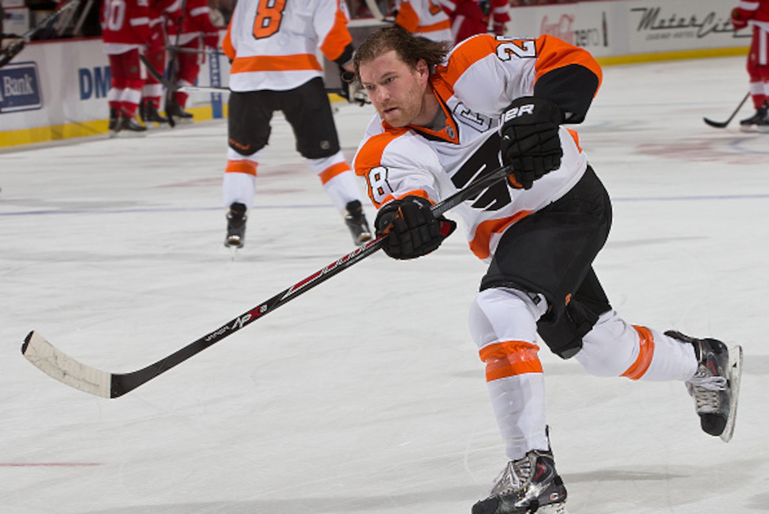 DETROIT, MI - NOVEMBER 26: Claude Giroux #28 of the Philadelphia Flyers shoots the puck in warm ups before a NHL game against the Detroit Red Wings on November 26, 2014 at Joe Louis Arena in Detroit, Michigan. (Photo by Dave Reginek/NHLI via Getty Images)
