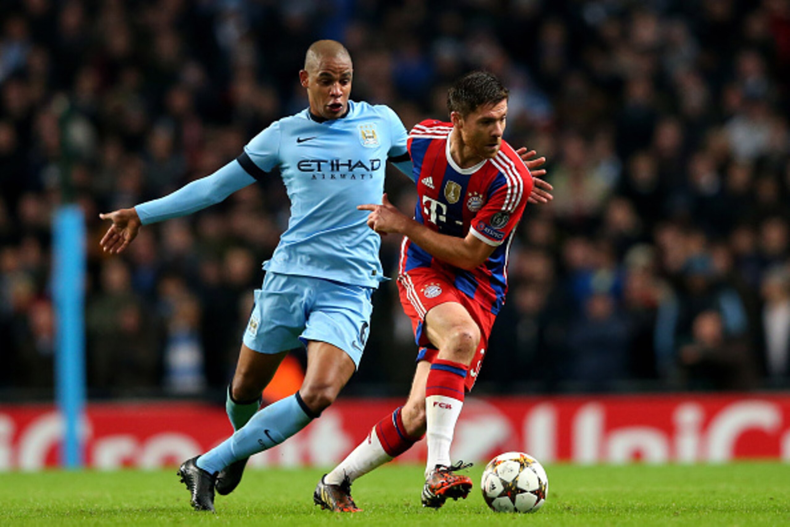 MANCHESTER, ENGLAND - NOVEMBER 25:  Xabi Alonso of Bayern Muenchen goes past the challenge from Fernando of Manchester City during the UEFA Champions League Group E match between Manchester City and FC Bayern Muenchen at the Etihad Stadium on November 25,