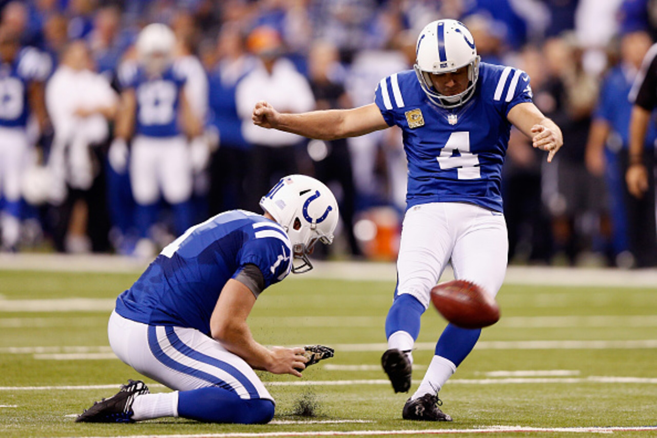 INDIANAPOLIS, IN - NOVEMBER 16:   Adam Vinatieri #4 of the Indianapolis Colts kicks a field goal in the first quarter against the New England Patriots at Lucas Oil Stadium on November 16, 2014 in Indianapolis, Indiana.  (Photo by Joe Robbins/Getty Images)
