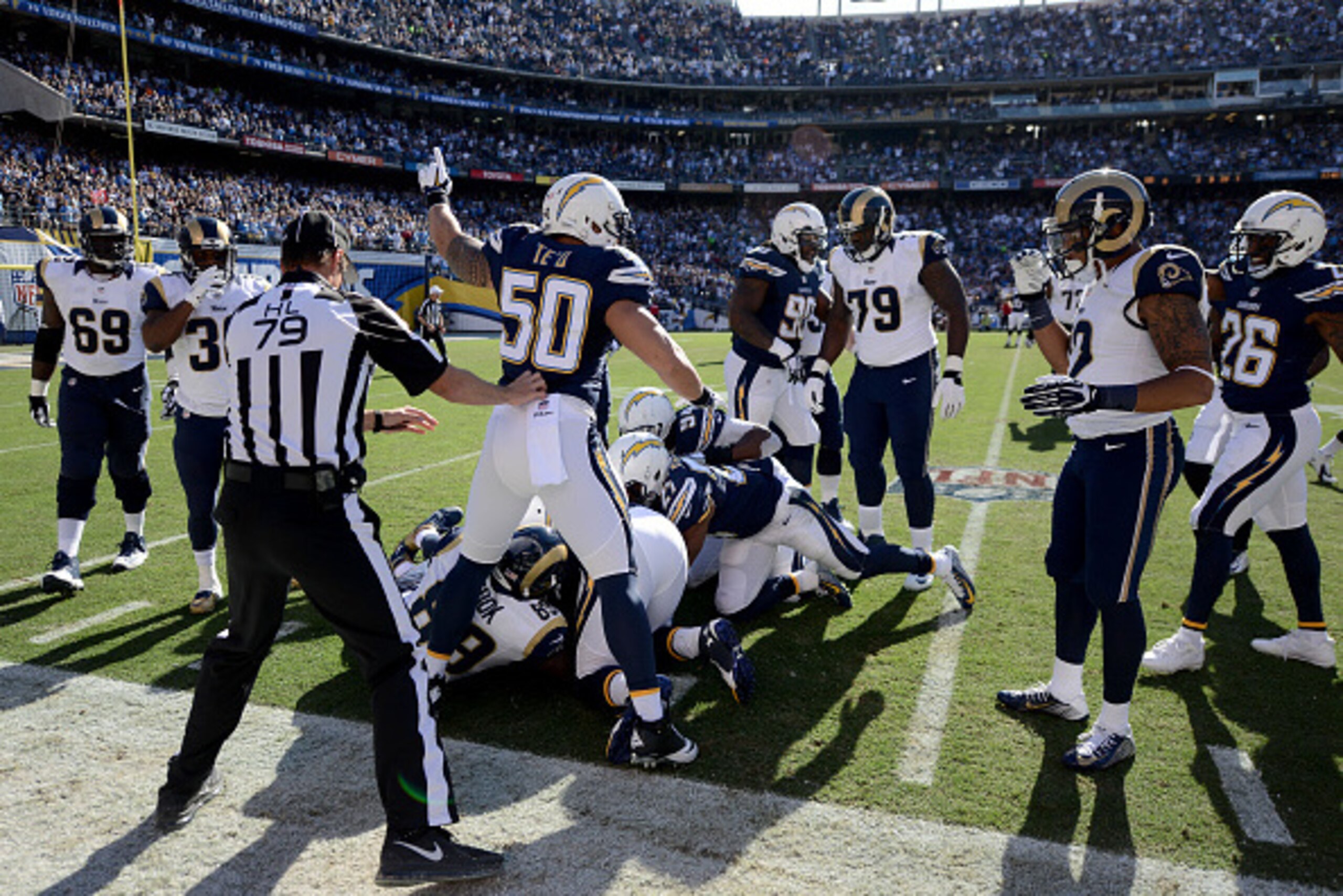 SAN DIEGO, CA - NOVEMBER 23:  Manti Te'o #50 of the San Diego Chargers celebrates the recovery of an interception and fumble against the St. Louis Rams during their NFL Game on November 23, 2014 in San Diego, California. (Photo by Donald Miralle/Getty Ima