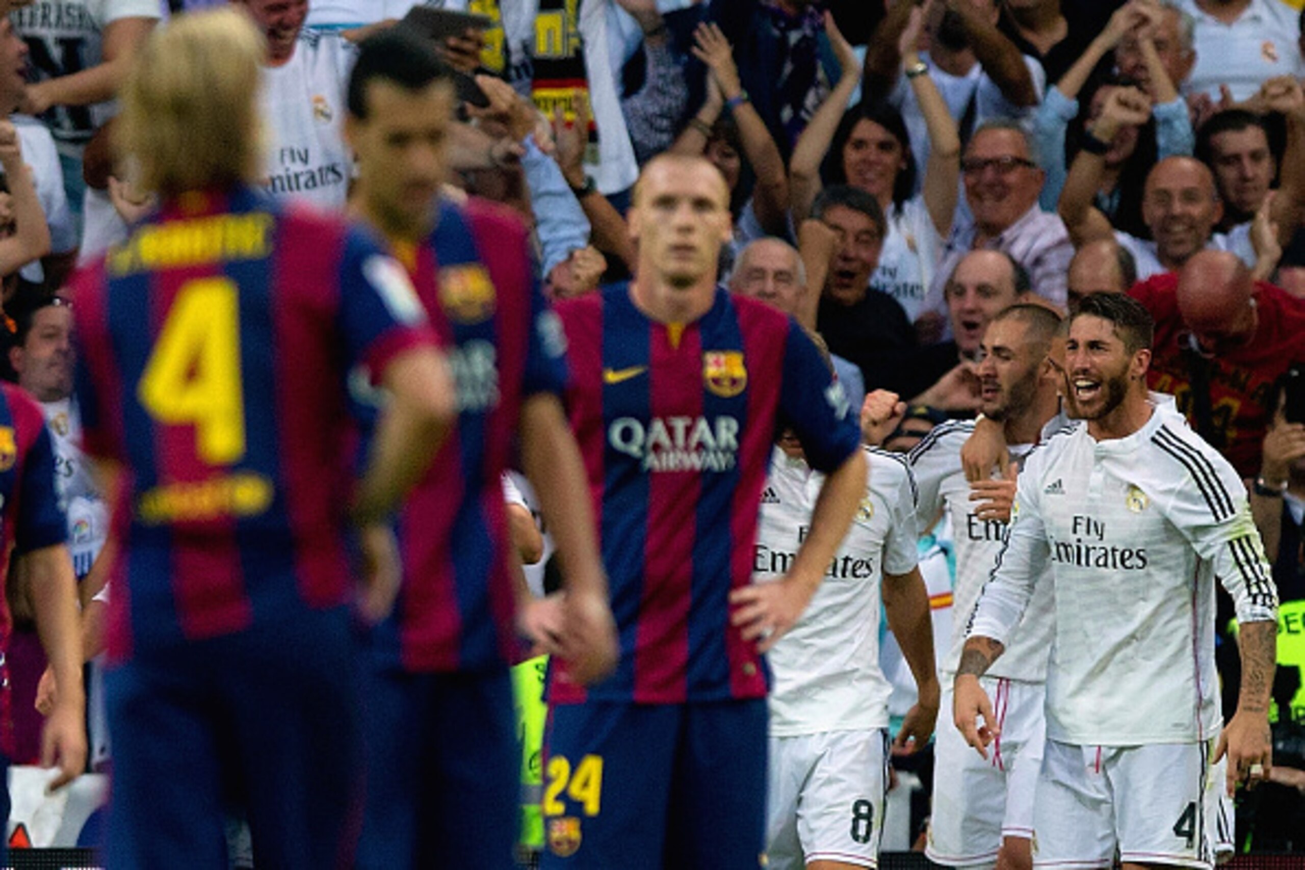 MADRID, SPAIN - OCTOBER 25:  Karim Benzema of Real Madrid CF celebrates scoring their third goal with Sergio Ramos of Real Madrid CF during the La Liga match between Real Madrid CF and FC Barcelona at Estadio Santiago Bernabeu on October 25, 2014 in Madri