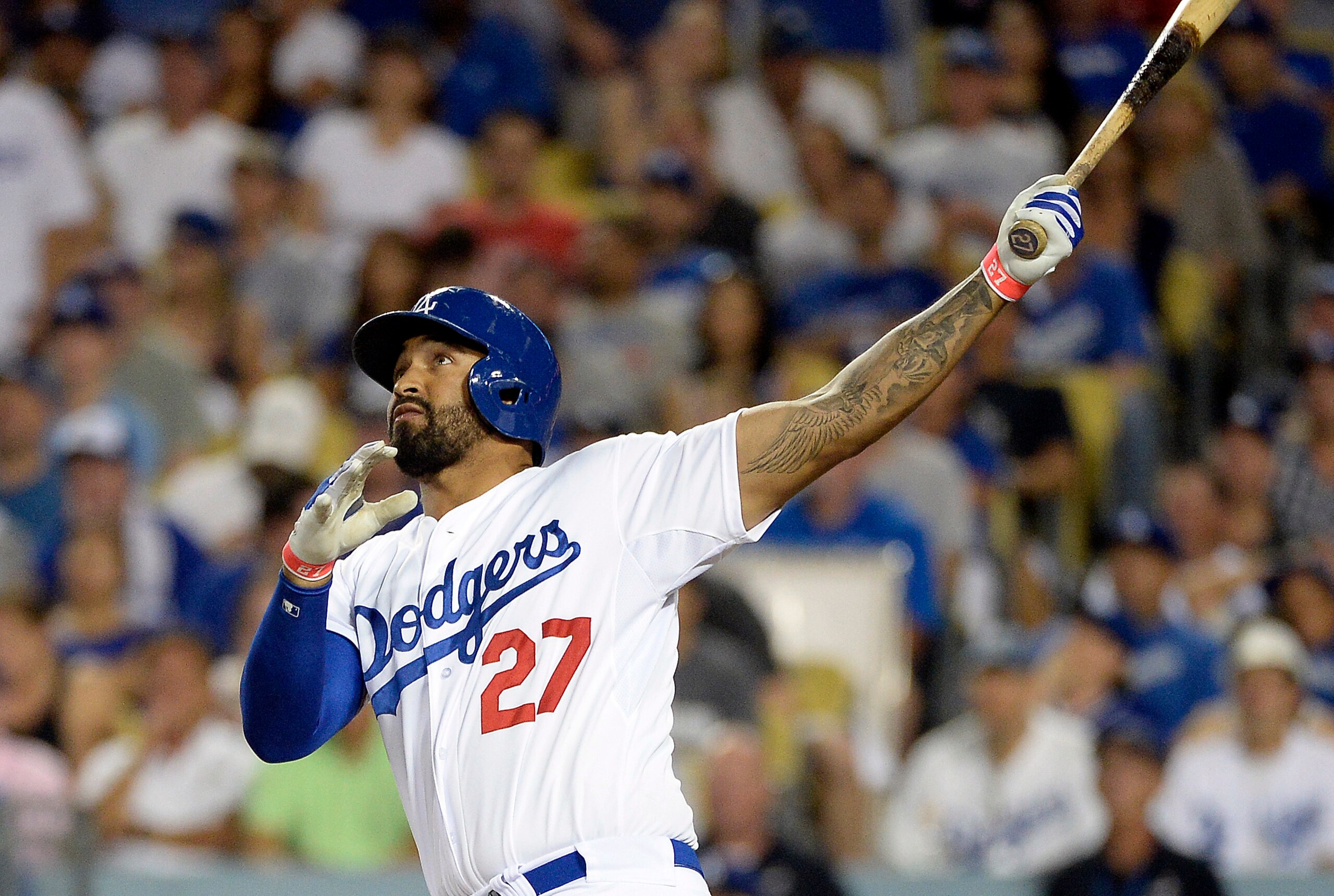 October 4, 2014; Los Angeles, CA, USA; Los Angeles Dodgers left fielder Matt Kemp (27) hits a solo home run in the eighth inning against the St. Louis Cardinals in game two of the 2014 NLDS playoff baseball game at Dodger Stadium. Mandatory Credit: Richar