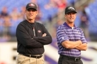 Aug 7, 2014; Baltimore, MD, USA; San Francisco 49ers head coach Jim Harbaugh (left) with Baltimore Ravens head coach John Harbaugh (right) prior to the game at M&T Bank Stadium. Mandatory Credit: Mitch Stringer-USA TODAY Sports