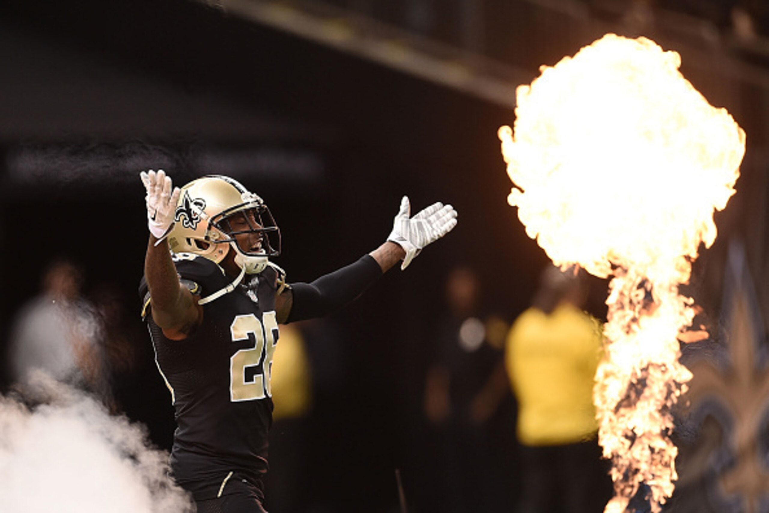NEW ORLEANS, LA - OCTOBER 26:  Keenan Lewis #28 of the New Orleans Saints runs onto the field at the start of the game against the Green Bay Packers at Mercedes-Benz Superdome on October 26, 2014 in New Orleans, Louisiana.  (Photo by Stacy Revere/Getty Im