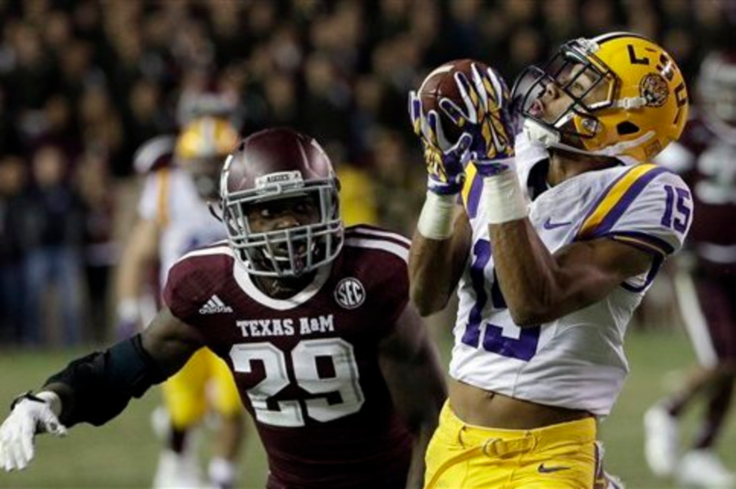 LSU wide receiver Malachi Dupre (No. 15) snatches a reception against Texas A&M.