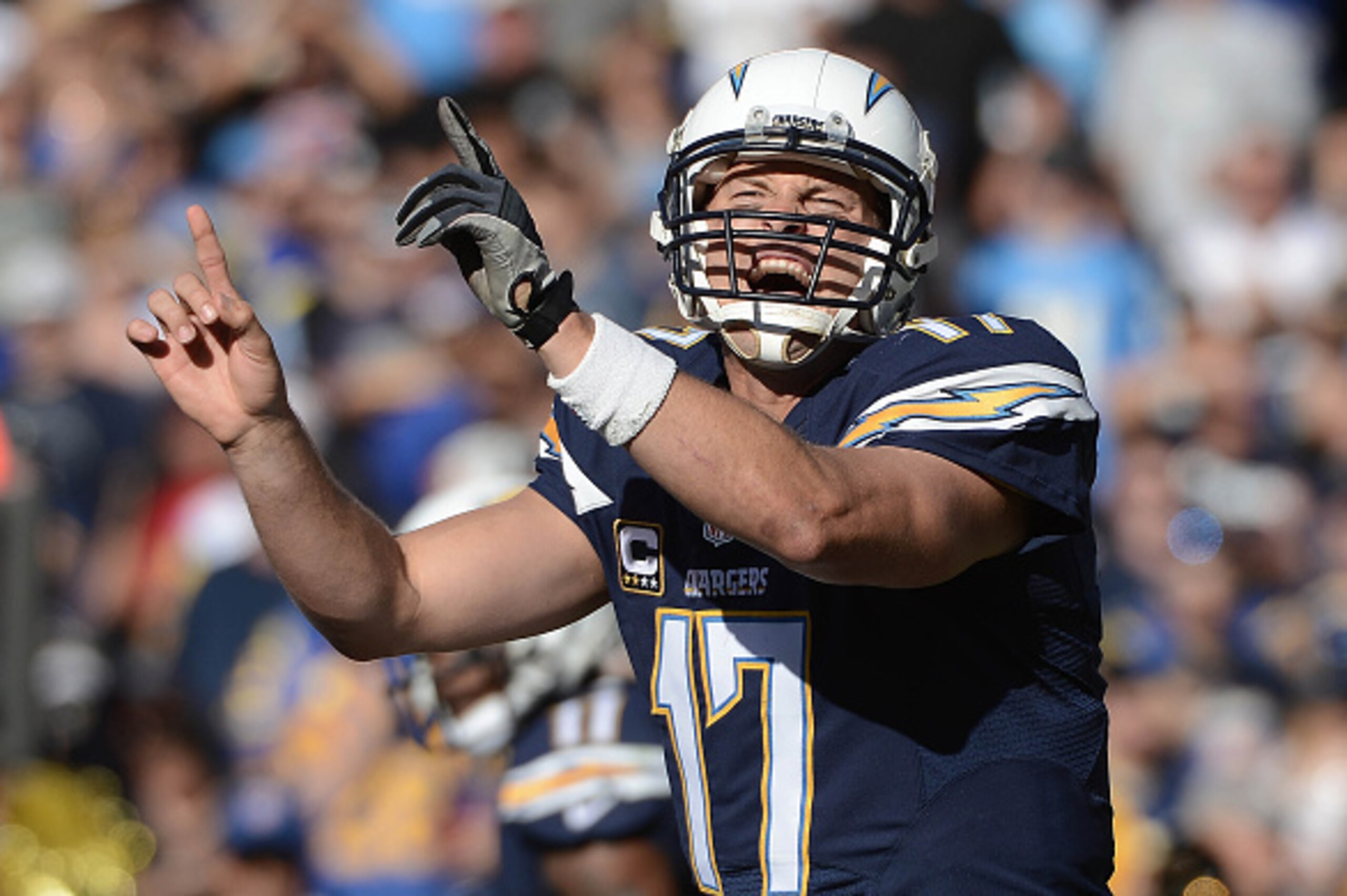 SAN DIEGO, CA- NOVEMBER 23:  Philip Rivers #17 of the San Diego Chargers calls the play at the line of scrimmage against the St. Louis Rams during their NFL Game on November 23, 2014 in San Diego, California. (Photo by Donald Miralle/Getty Images)