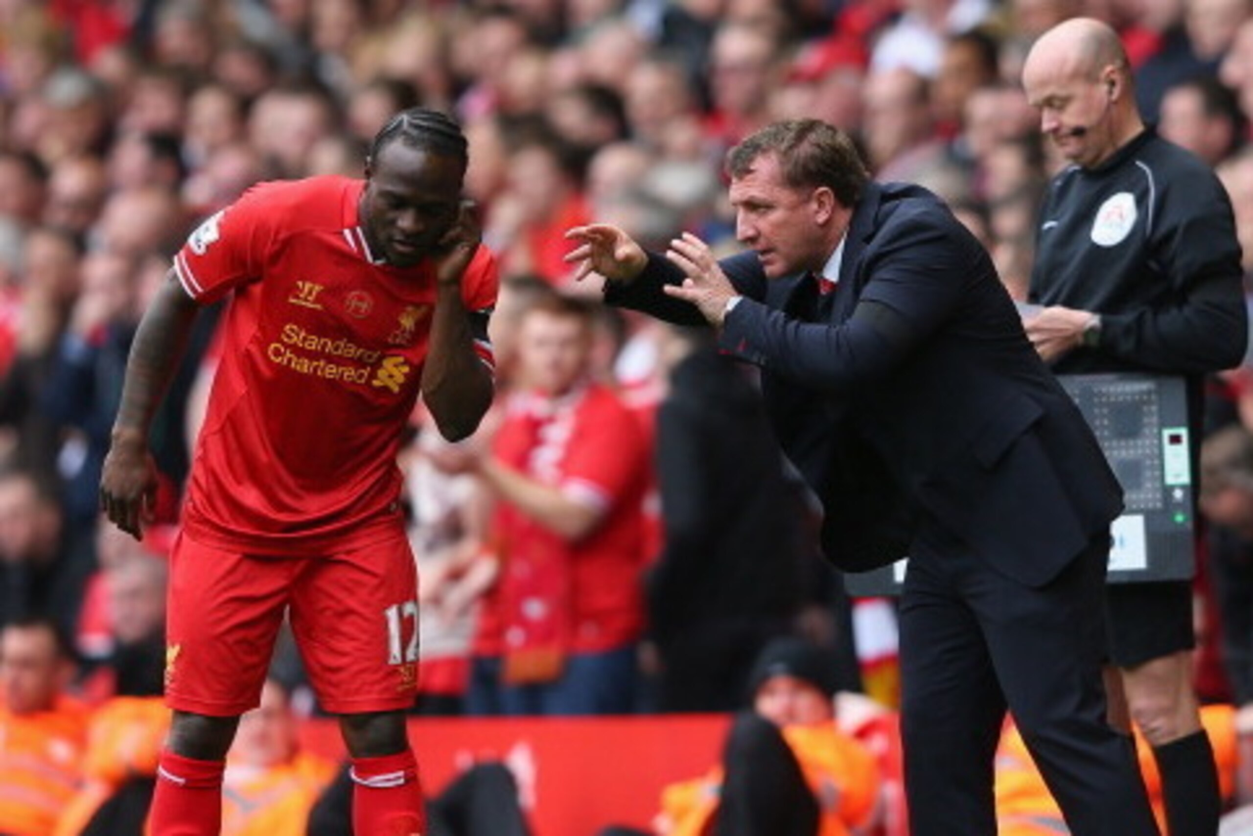 LIVERPOOL, ENGLAND - APRIL 13:  Liverpool Manager Brendan Rodgers gives orders to Victor Moses during the Barclays Premier League match between Liverpool and Manchester City at Anfield on April 13, 2014 in Liverpool, England.  (Photo by Alex Livesey/Getty