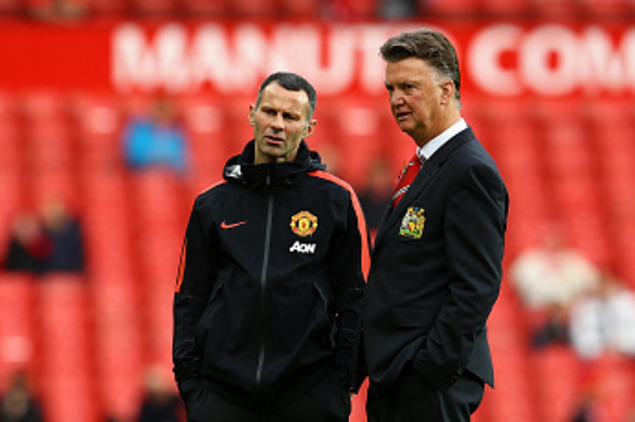 MANCHESTER, ENGLAND - NOVEMBER 08:  Manchester United Manager Louis van Gaal looks on with his Assistant Ryan Giggs (L) prior to the Barclays Premier League match between Manchester United and Crystal Palace at Old Trafford on November 8, 2014 in Manchest
