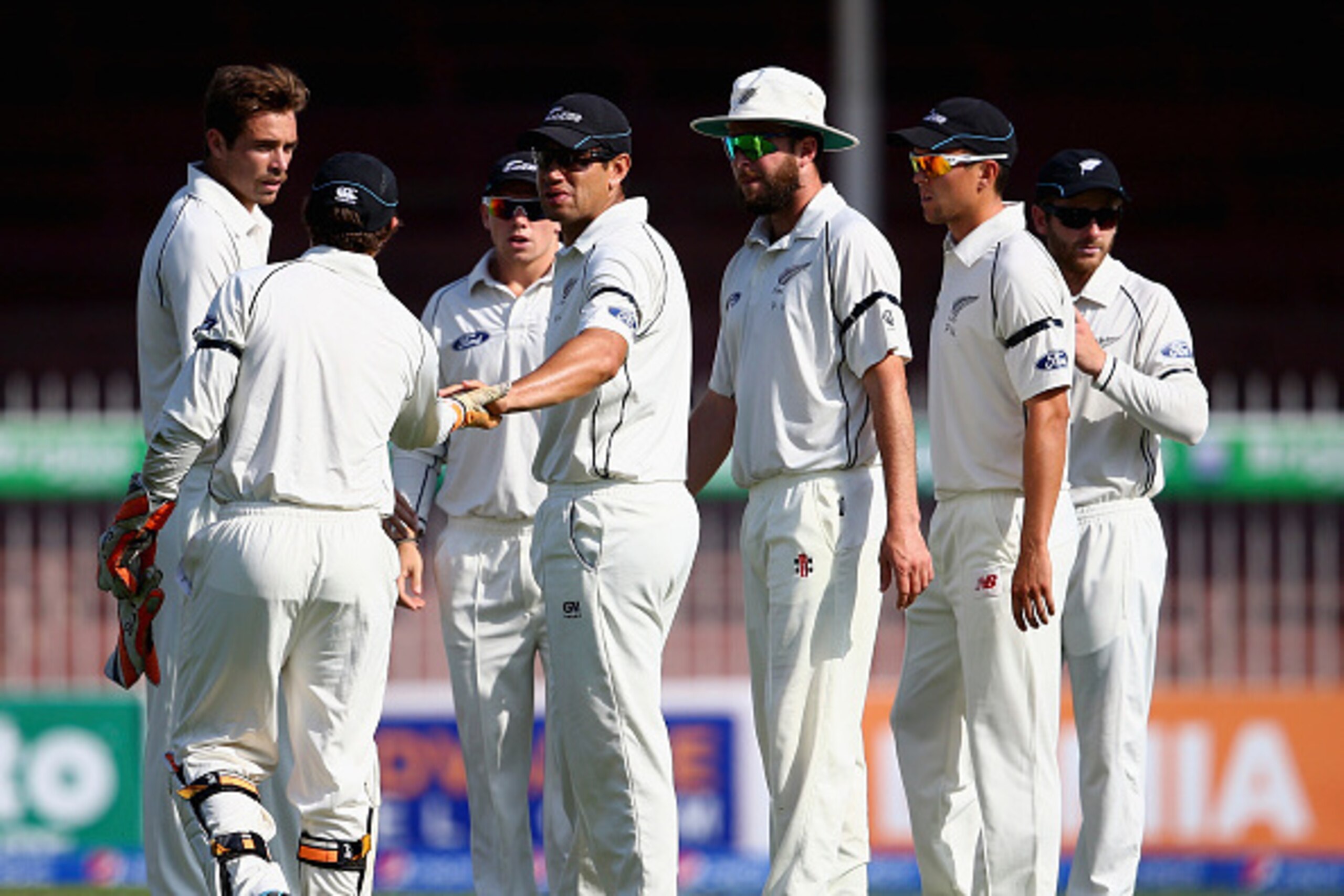 SHARJAH, UNITED ARAB EMIRATES - NOVEMBER 28:  Tim Southee of New Zealand celebrates with team-mates after dismissing Misbah Ul Haq of Pakistan during day two of the third test between Pakistan and New Zealand at Sharjah Stadium on November 28, 2014 in Sha