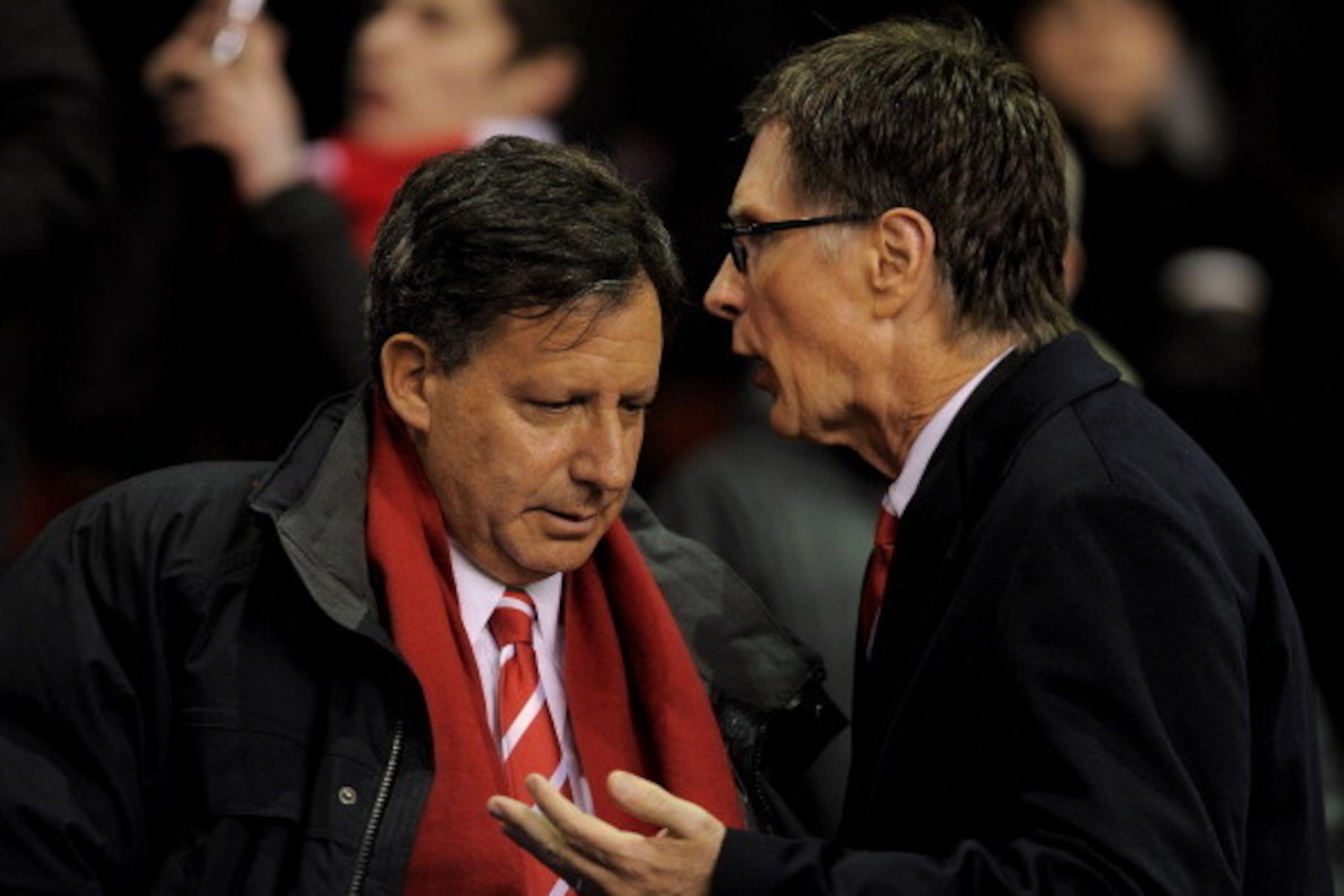LIVERPOOL, ENGLAND - JANUARY 25:  Liverpool owners Tom Werner (L) and John Henry speak prior to the Carling Cup Semi Final Second Leg match between Liverpool and Manchester City at Anfield on January 25, 2012 in Liverpool, England.  (Photo by Michael Rega