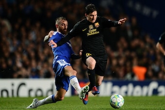 LONDON, ENGLAND - APRIL 18:  Lionel Messi of Barcelona is challenged by Raul Meireles of Chelsea during the UEFA Champions League Semi Final first leg match between Chelsea and Barcelona at Stamford Bridge on April 18, 2012 in London, England.  (Photo by 