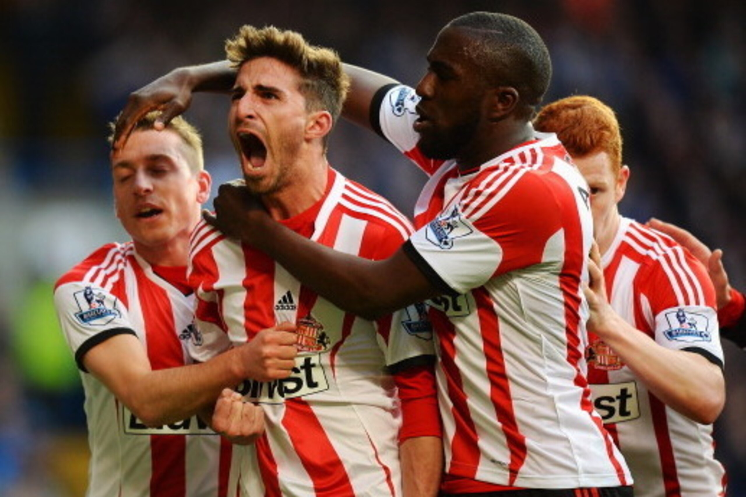 LONDON, ENGLAND - APRIL 19:  Fabio Borini (C) of Sunderland celebrates with team mates after scoring his sides second goal from the penalty spot during the Barclays Premier League match between Chelsea and Sunderland at Stamford Bridge on April 19, 2014 i