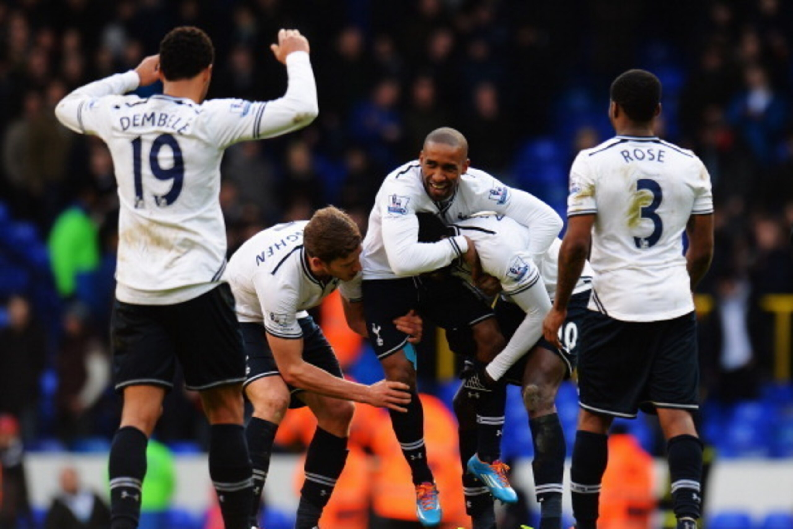LONDON, ENGLAND - FEBRUARY 09:  Jermain Defoe (C) of Tottenham Hotspur is carried on the shoulders of team mates Jan Vertonghen (L) and Emmanuel Adebayor (R) at the end of his final home game before joining Toronto FC following the Barclays Premier League