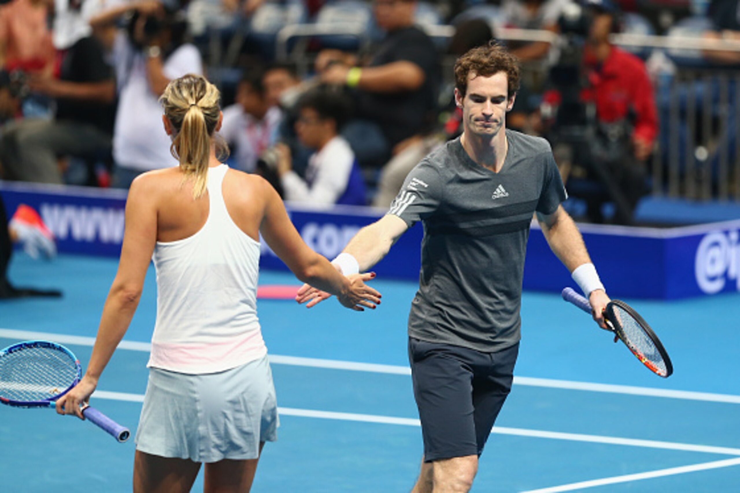 MANILA, PHILIPPINES - NOVEMBER 28:  Andy Murray and Maria Sharapova of the Manila Mavericks celebrate a point against Kristina Mladenovic and Nenad Zimonjic of the UAE Royals during their doubles match at the Coca-Cola International Premier Tennis League 