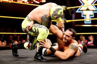 Sin Cara in control of Tye Dillinger.