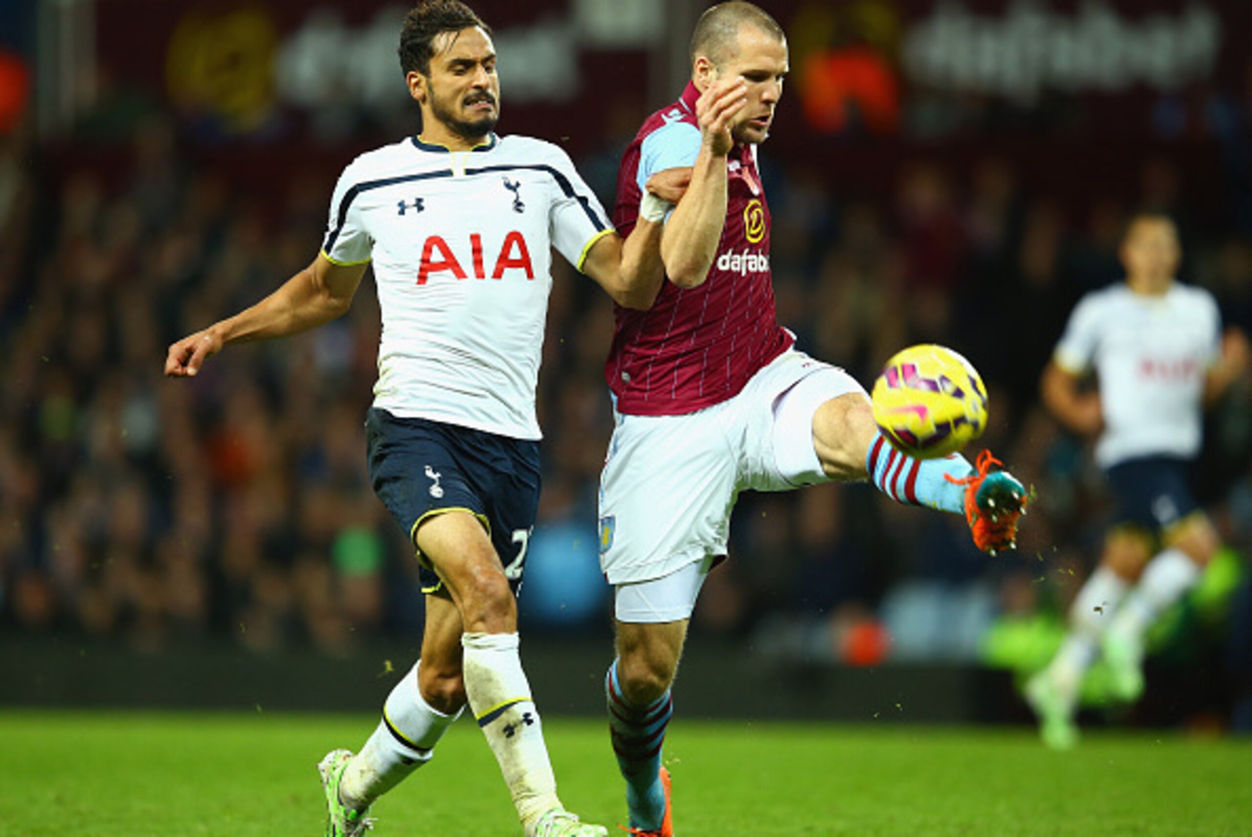 BIRMINGHAM, ENGLAND - NOVEMBER 02: Nacer Chadli of Spurs and Ron Vlaar of Aston Villa compete for the ball during the Barclays Premier League match between Aston Villa and Tottenham Hotspur at Villa Park on November 2, 2014 in Birmingham, England. (Photo BIRMINGHAM, ENGLAND - NOVEMBER 02: Nacer Chadli of Spurs and Ron Vlaar of Aston Villa compete for the ball during the Barclays Premier League match between Aston Villa and Tottenham Hotspur at Villa Park on November 2, 2014 in Birmingham, England. (Photo