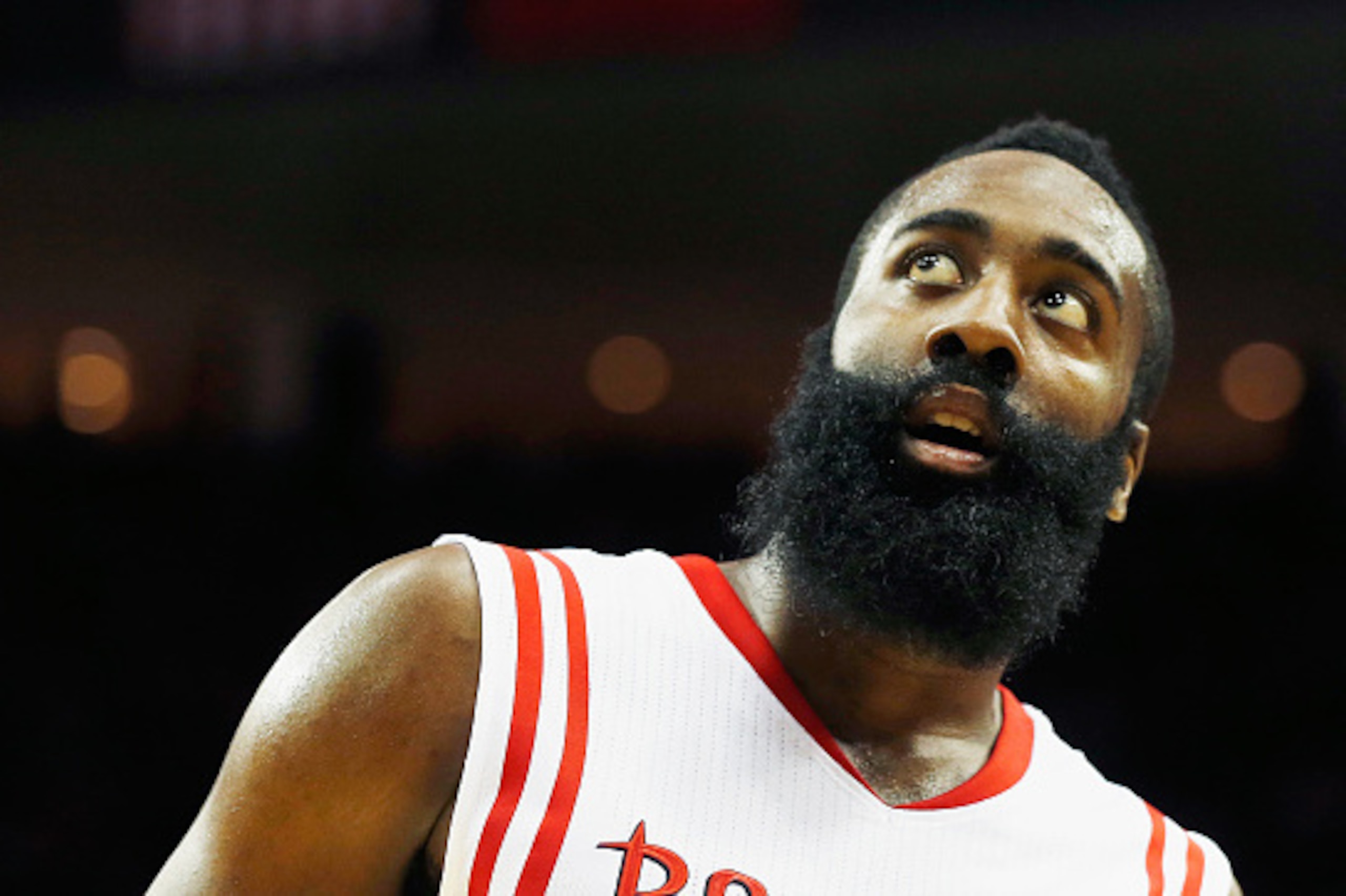 HOUSTON, TX - NOVEMBER 24:  James Harden #13 of the Houston Rockets walks across the court during their game against the New York Knicks at the Toyota Center on November 24, 2014 in Houston, Texas.  NOTE TO USER: User expressly acknowledges and agrees tha
