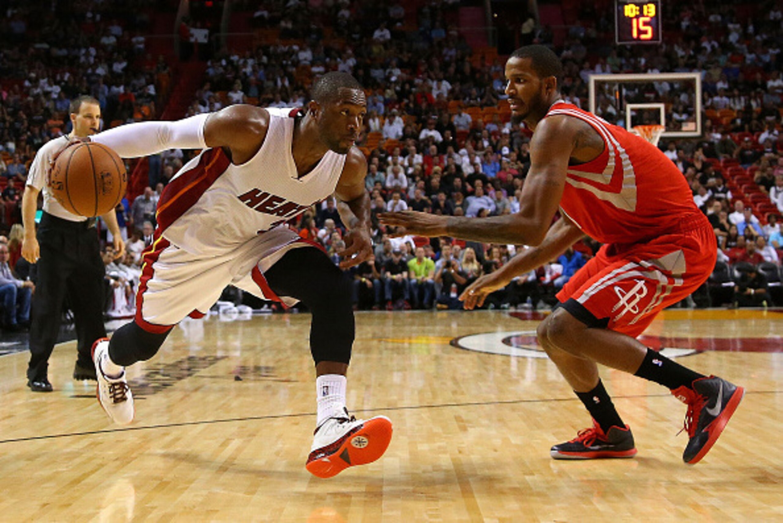 MIAMI, FL - NOVEMBER 04: Dwyane Wade #3 of the Miami Heat drives on Trevor Ariza #1 of the Houston Rockets during a game  at American Airlines Arena on November 4, 2014 in Miami, Florida. NOTE TO USER: User expressly acknowledges and agrees that, by downl