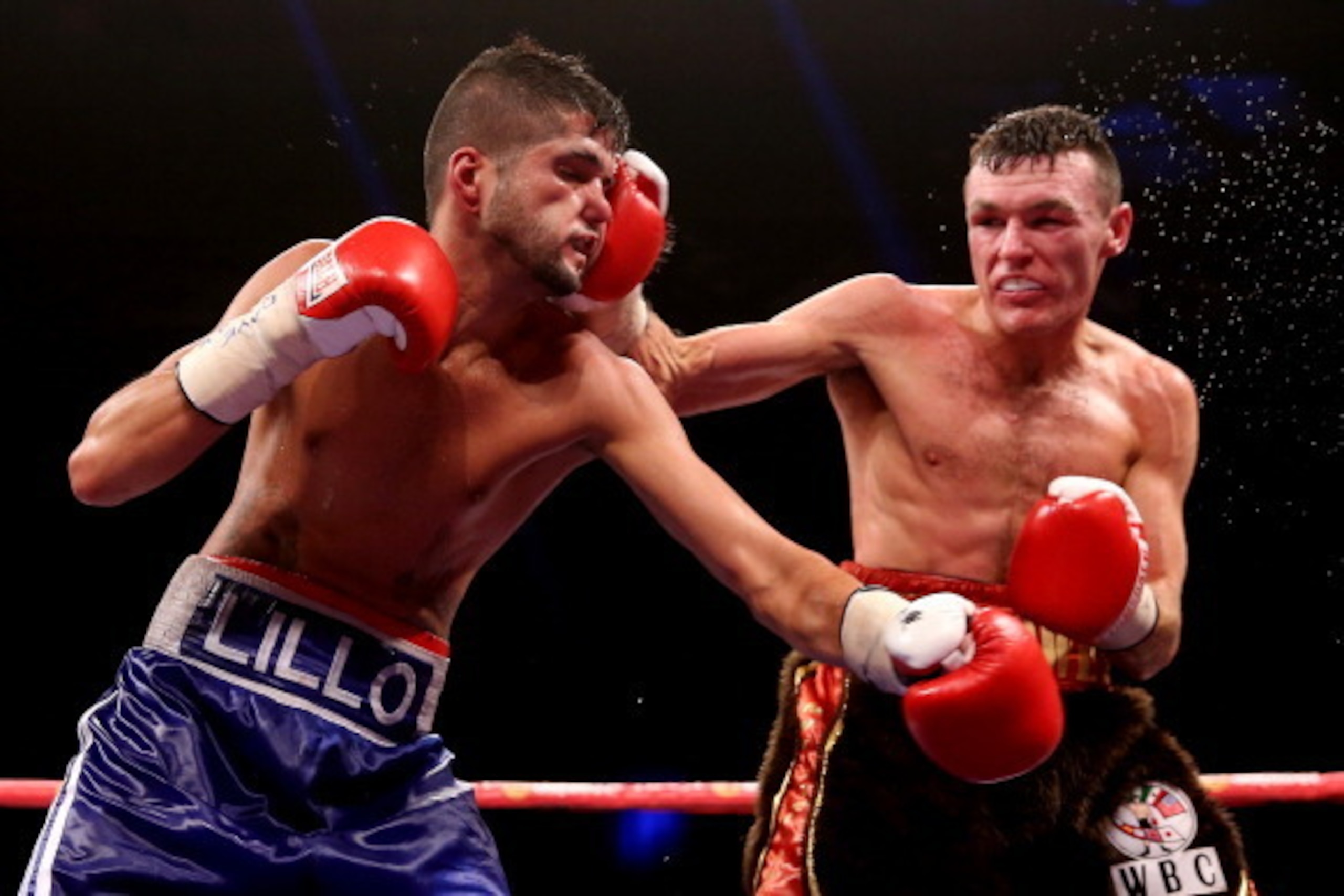 GLASGOW, SCOTLAND - SEPTEMBER 07:  Jonathan Slowey in action with Angel Lorente during their International Featherweight Silver Championship bout at SECC on September 7, 2013 in Glasgow, Scotland.  (Photo by Scott Heavey/Getty Images)