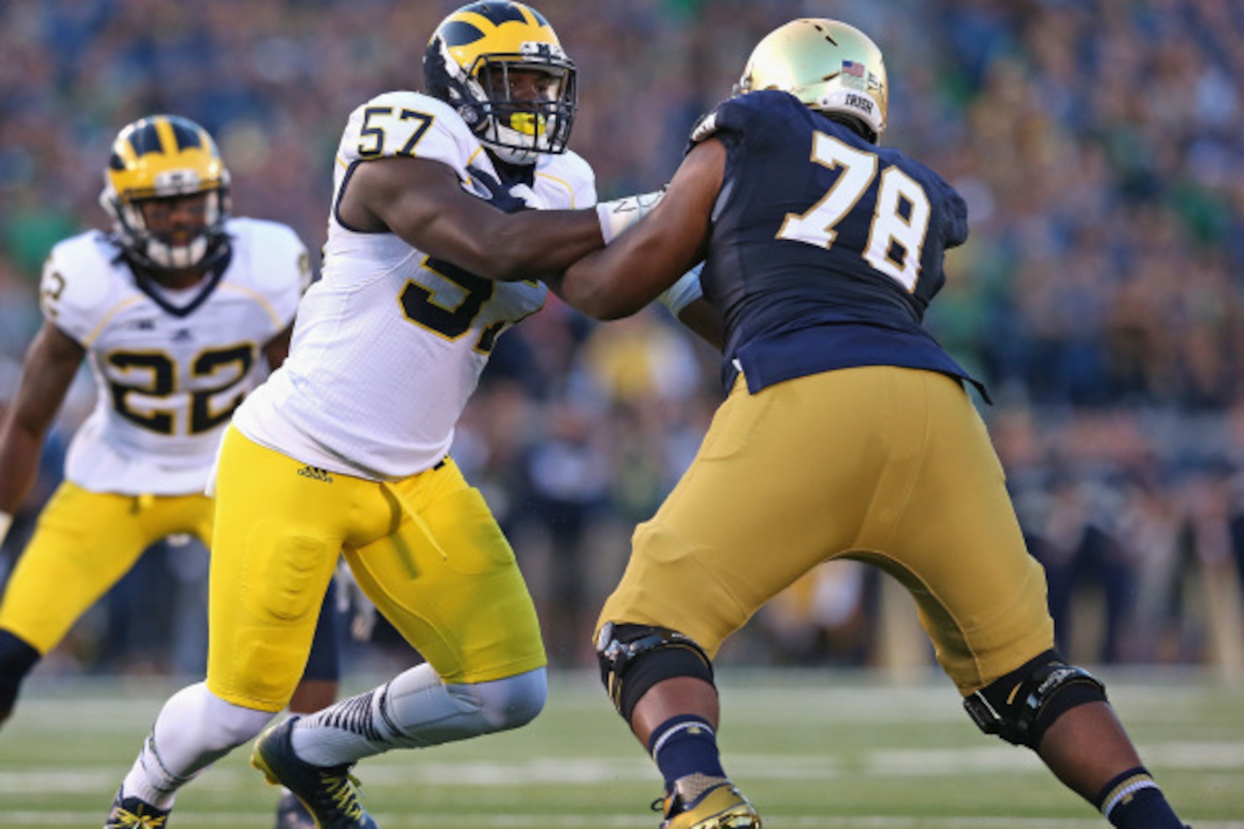 SOUTH BEND, IN - SEPTEMBER 06:  Frank Clark #57 of the Michigan Wolverines rushes against Ronnie Stanley #78 of the Notre Dame Fighting Irish at Notre Dame Stadium on September 6, 2014 in South Bend, Indiana. Notre Dame defeated Michigan 31-0.  (Photo by 