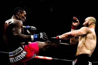 RIO DE JANEIRO, BRAZIL - OCTOBER 25:  Phil Davis of the United States kicks Glover Teixeira of Brazil in their light heavyweight bout during the UFC 179 event at Maracanazinho on October 25, 2014 in Rio de Janeiro, Brazil.  (Photo by Buda Mendes/Getty Ima