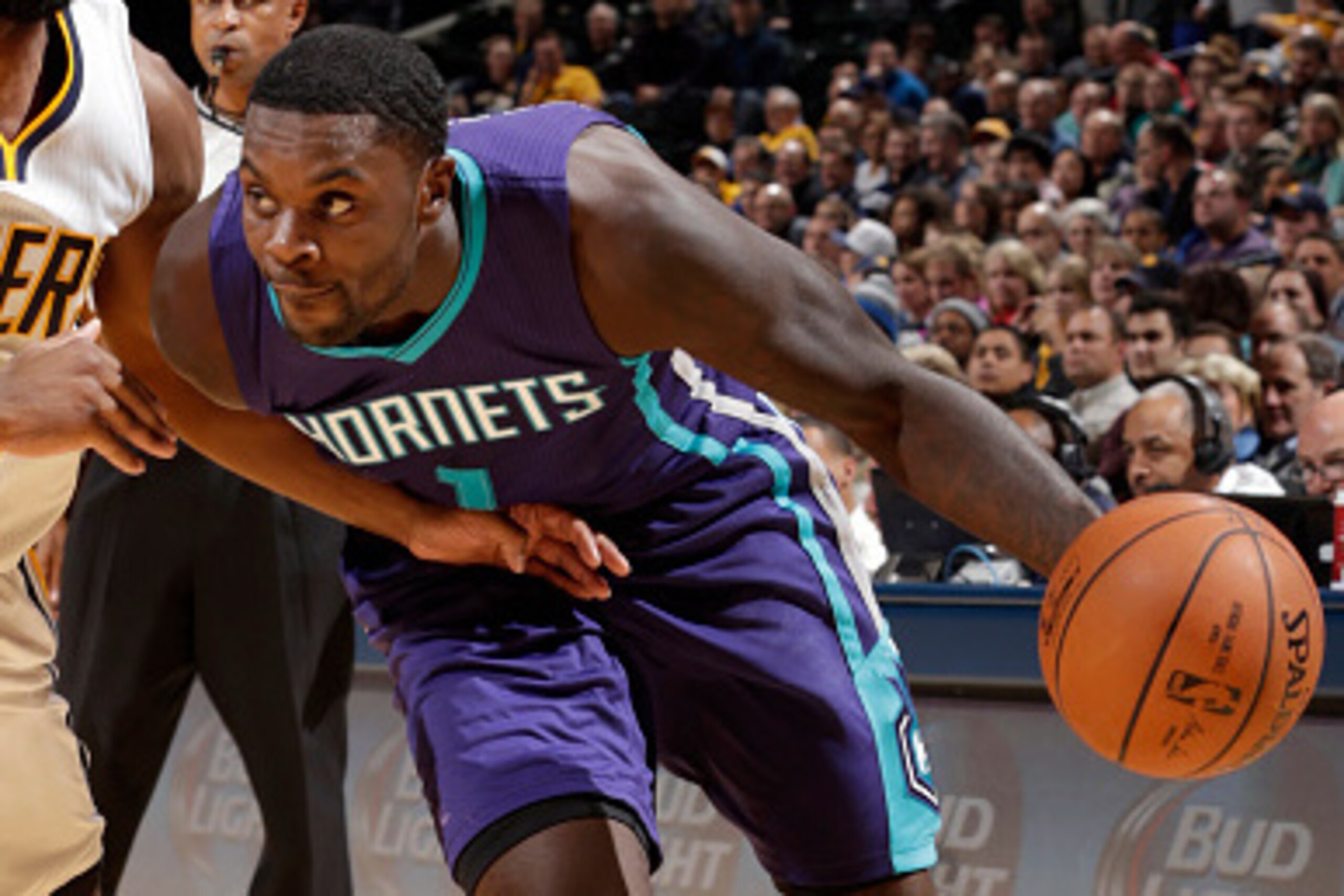 INDIANAPOLIS, IN - NOVEMBER 19: Lance Stephenson #1 of the Charlotte Hornets handles the ball against the Indiana Pacers at Bankers Life Fieldhouse on November 19, 2014 in Indianapolis, Indiana. NOTE TO USER: User expressly acknowledges and agrees that, b