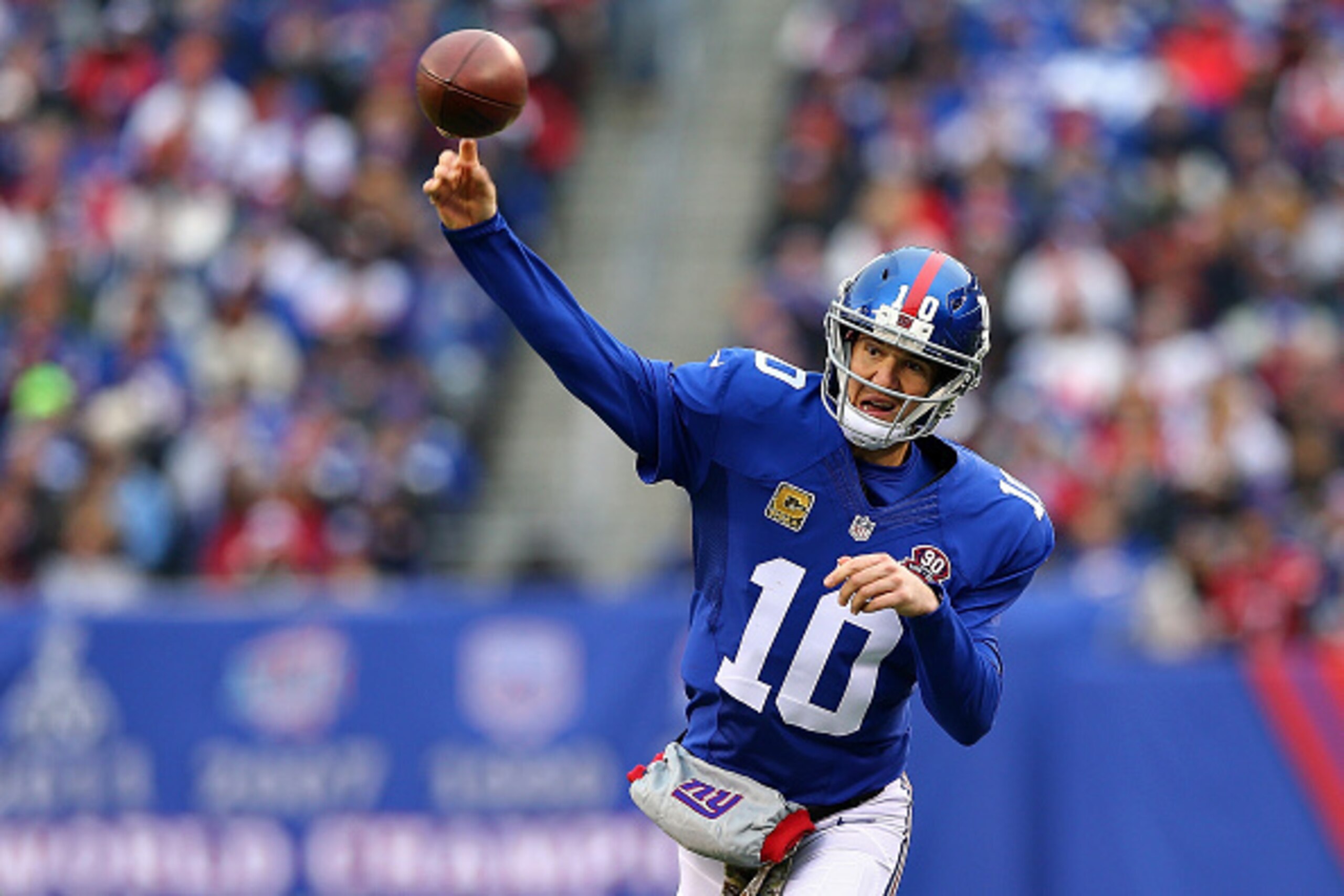 EAST RUTHERFORD, NJ - NOVEMBER 16:   Eli Manning #10 of the New York Giants throws an interception against the San Francisco 49ers in the third quarter at MetLife Stadium on November 16, 2014 in East Rutherford, New Jersey.  (Photo by Elsa/Getty Images)