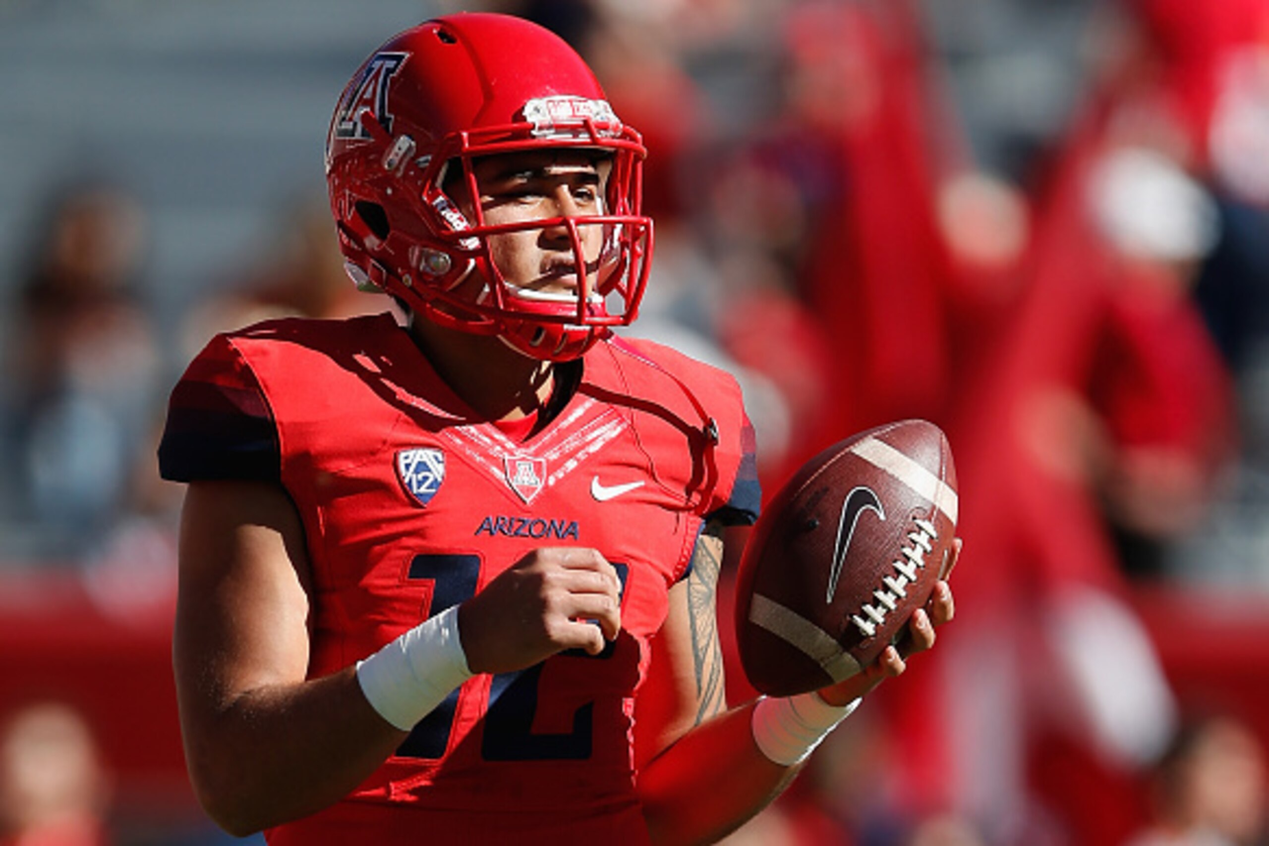 TUCSON, AZ - NOVEMBER 28: Quarterback Anu Solomon #12 of the Arizona Wildcats warms up prior to the Territorial Cup college football game against the Arizona State Sun Devils at Arizona Stadium on November 28, 2014 in Tucson, Arizona.  (Photo by Christian