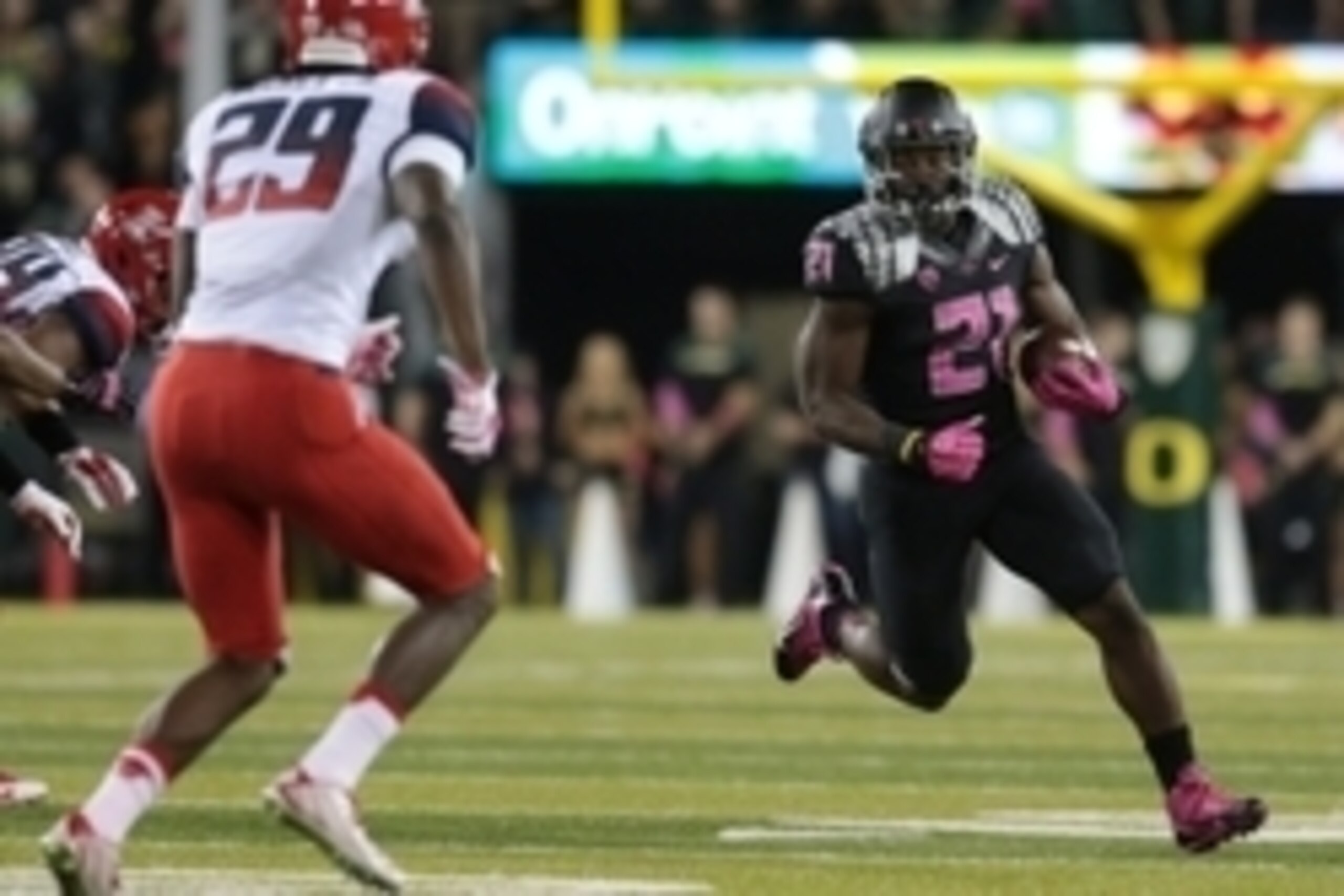 Oct 2, 2014; Eugene, OR, USA; Arizona Wildcats cornerback Jarvis McCall Jr. (29) defends as Oregon Ducks running back Royce Freeman (21) runs the ball at Autzen Stadium. Mandatory Credit: Scott Olmos-USA TODAY Sports