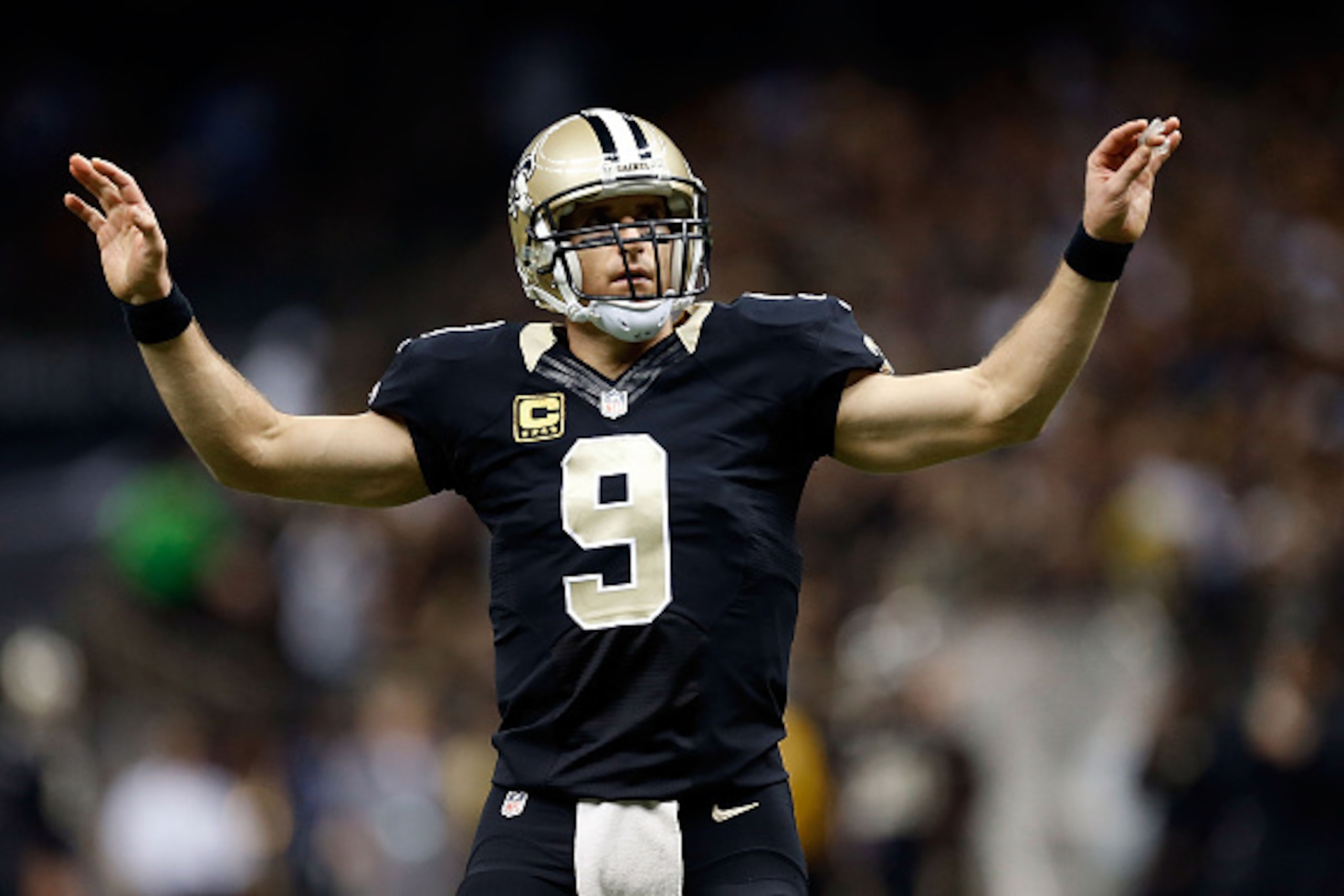 NEW ORLEANS, LA - NOVEMBER 24:  Drew Brees #9 of the New Orleans Saints reacts to a defensive stop during the first quarter of a game against the Baltimore Ravens at the Mercedes-Benz Superdome on November 24, 2014 in New Orleans, Louisiana.  (Photo by We