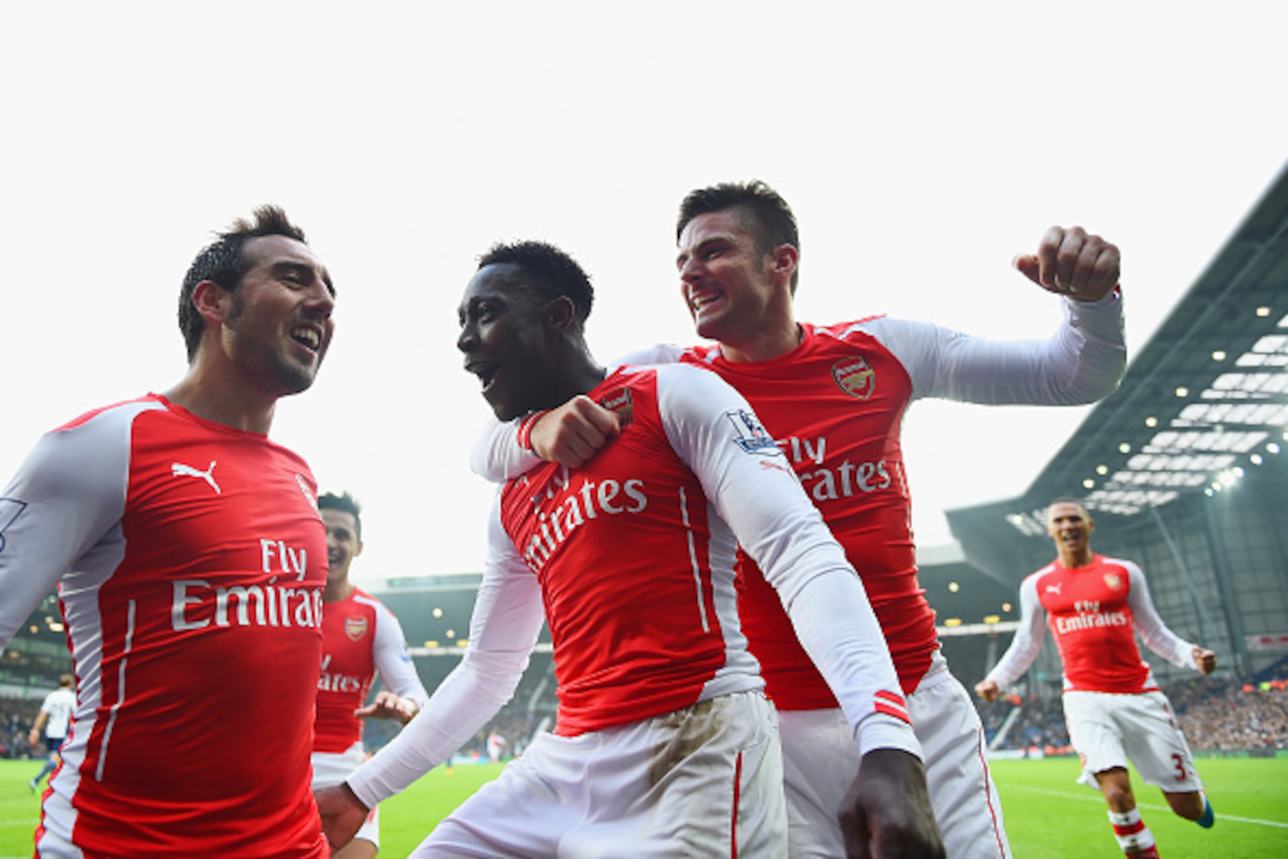 WEST BROMWICH, ENGLAND - NOVEMBER 29:  Danny Welbeck of Arsenal (C) celebrates with team mate Olivier Giroud (R) and Santi Cazorla (L) as he scores their first goal during the Barclays Premier League match between West Bromwich Albion and Arsenal at The H