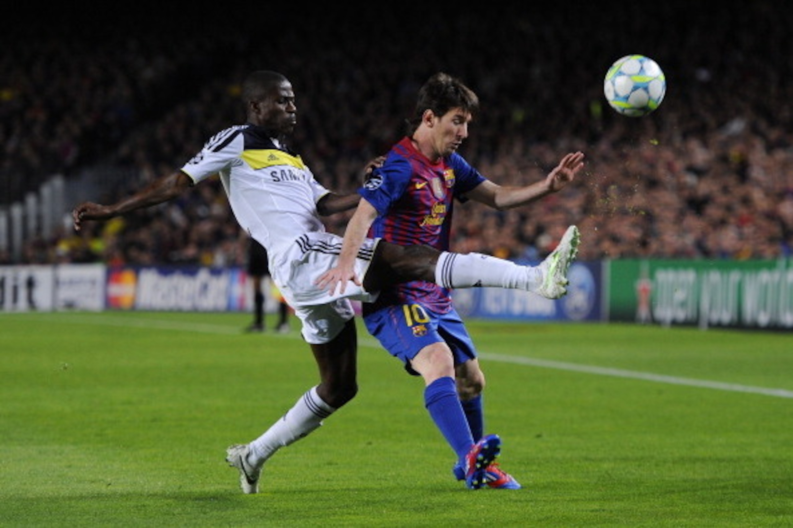 BARCELONA, SPAIN - APRIL 24: Lionel Messi of FC Barcelona (R) duels for the ball with Ramires of Chelsea during the UEFA Champions League Semi Final, second leg match between FC Barcelona and Chelsea FC at Camp Nou on April 24, 2012 in Barcelona, Spain.  