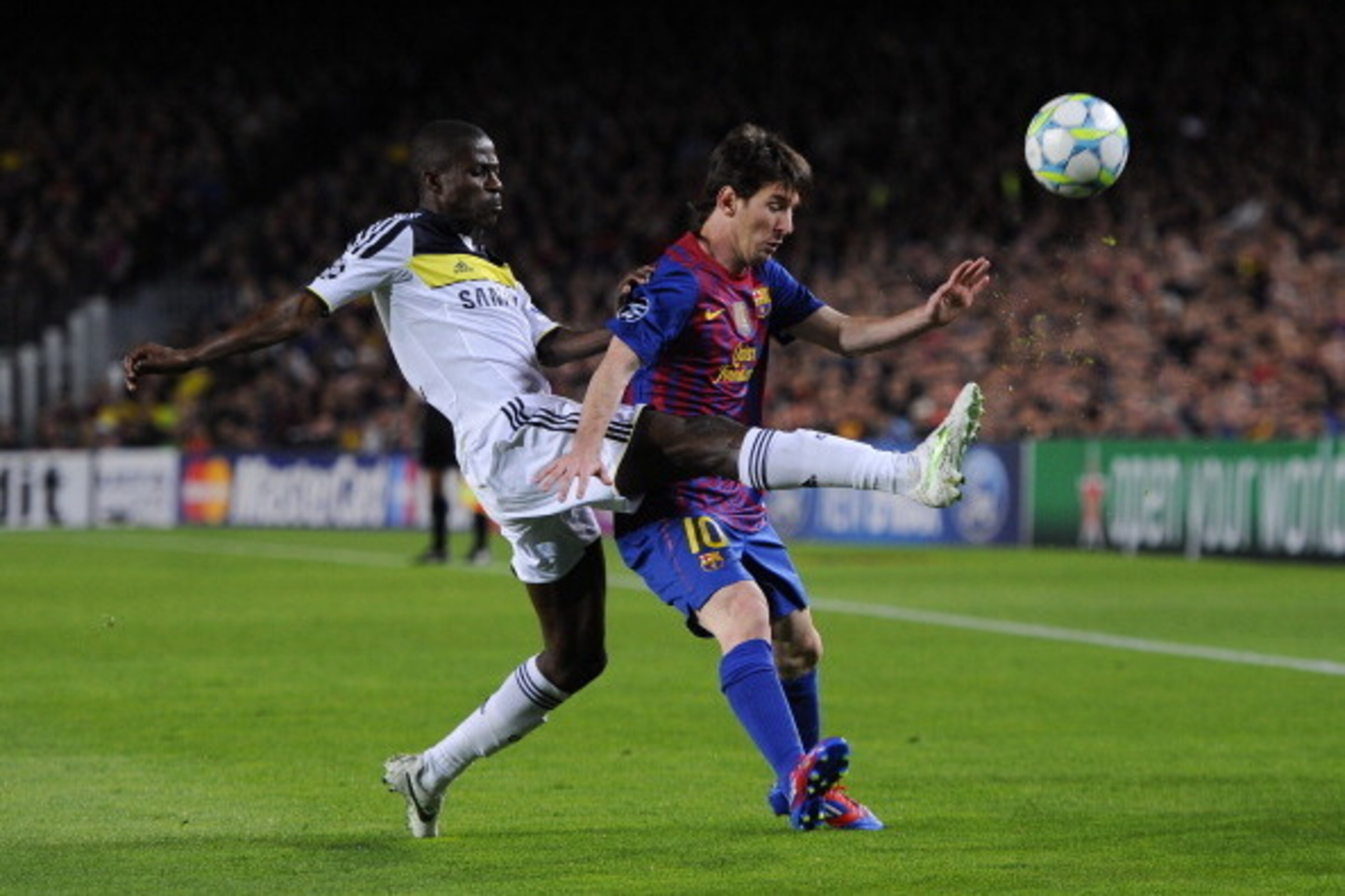BARCELONA, SPAIN - APRIL 24: Lionel Messi of FC Barcelona (R) duels for the ball with Ramires of Chelsea during the UEFA Champions League Semi Final, second leg match between FC Barcelona and Chelsea FC at Camp Nou on April 24, 2012 in Barcelona, Spain.  