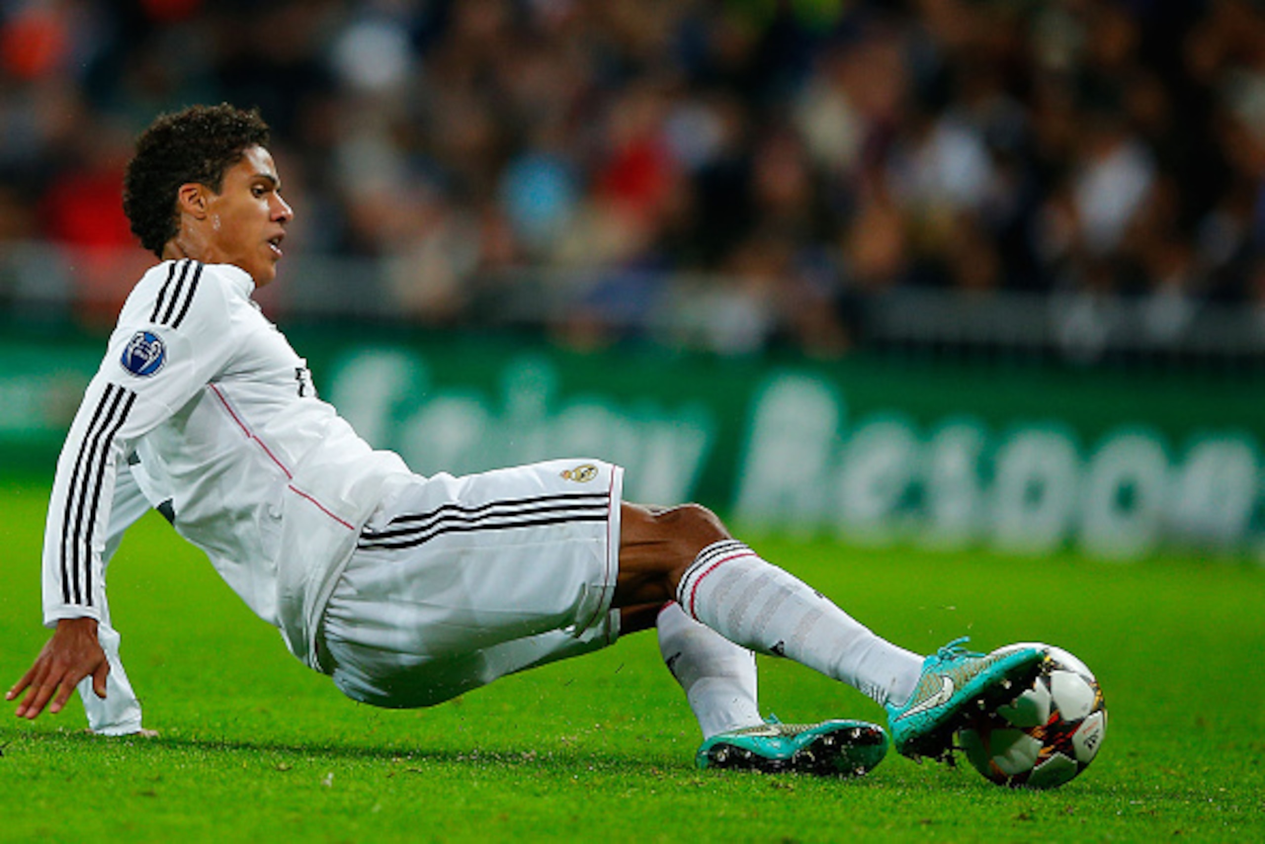 MADRID, SPAIN - NOVEMBER 04: Raphael Varane of Real Madrid CF saves the ball during the UEFA Champions League Group B match between Real Madrid CF and Liverpool FC at Estadio Santiago Bernabeu on November 4, 2014 in Madrid, Spain.  (Photo by Gonzalo Arroy