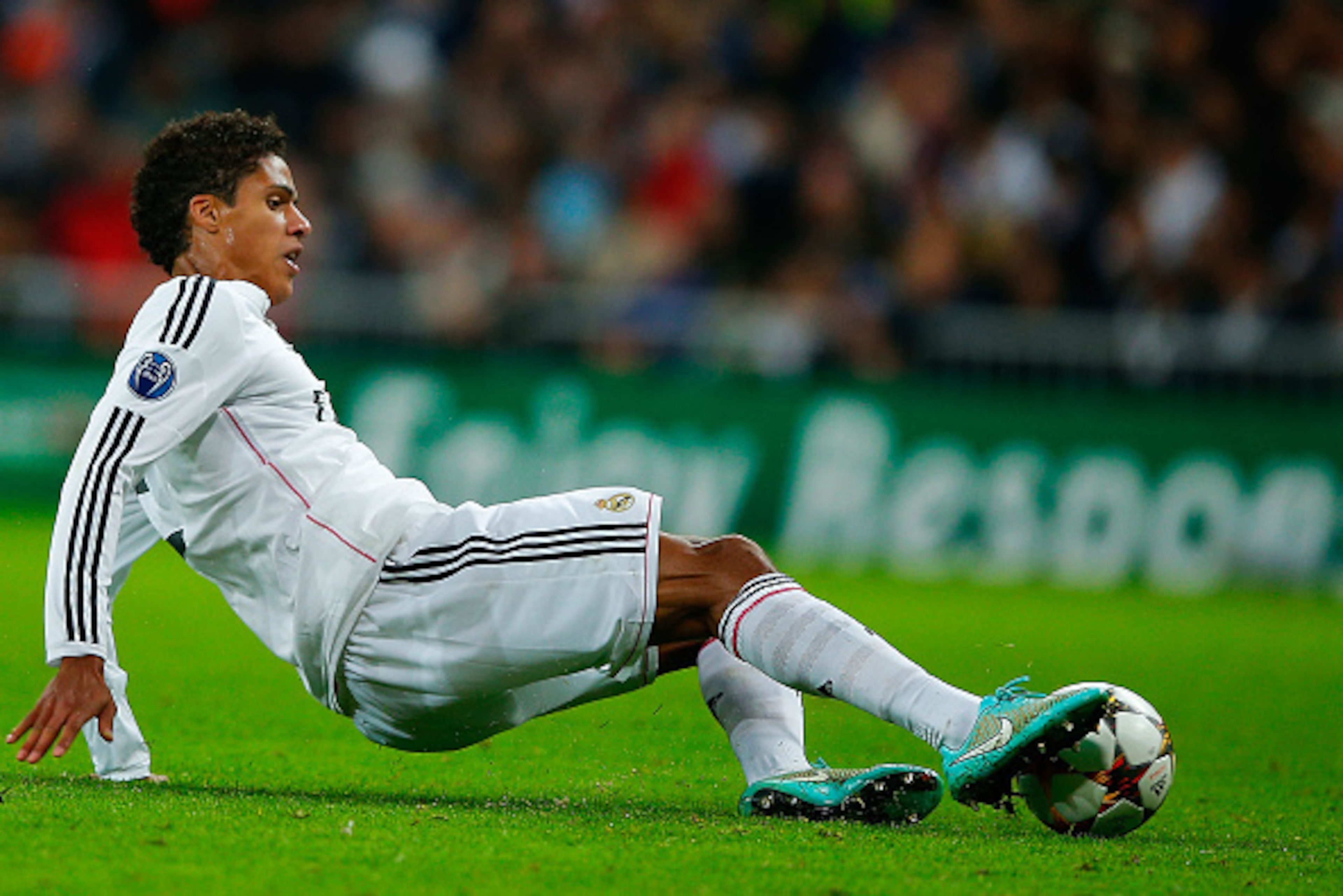MADRID, SPAIN - NOVEMBER 04: Raphael Varane of Real Madrid CF saves the ball during the UEFA Champions League Group B match between Real Madrid CF and Liverpool FC at Estadio Santiago Bernabeu on November 4, 2014 in Madrid, Spain.  (Photo by Gonzalo Arroy