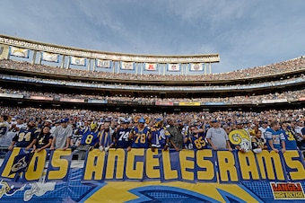 SAN DIEGO, CA - NOVEMBER 23:   Fans of the St. Louis Rams hold a 'Los Angeles Rams' sign against the San Diego Chargers during their NFL Game on November 23, 2014 in San Diego, California. (Photo by Donald Miralle/Getty Images)