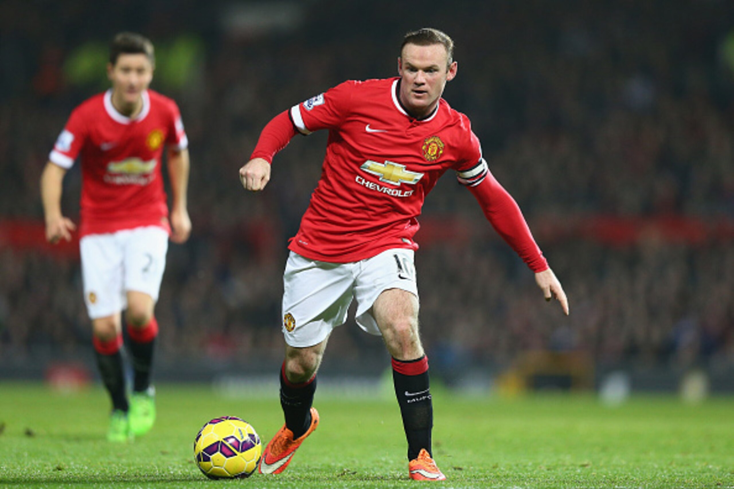 MANCHESTER, ENGLAND - NOVEMBER 29:  Wayne Rooney of Manchester United in action during the Barclays Premier League match between Manchester United and Hull City at Old Trafford on November 29, 2014 in Manchester, England.  (Photo by Clive Mason/Getty Imag