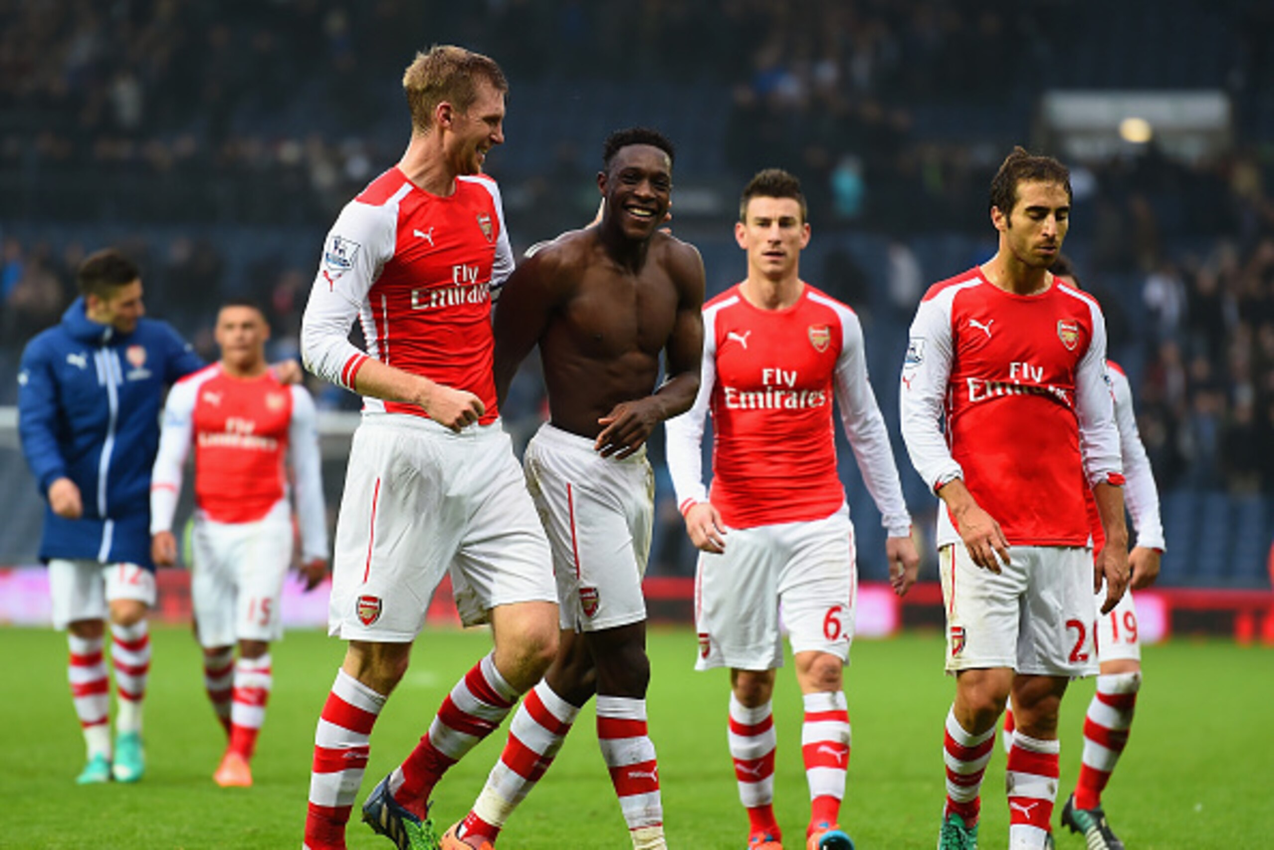 WEST BROMWICH, ENGLAND - NOVEMBER 29:  Per Mertesacker of Arsenal shares a joke with Danny Welbeck of Arsenal after the Barclays Premier League match between West Bromwich Albion and Arsenal at The Hawthorns on November 29, 2014 in West Bromwich, England.