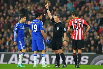 SUNDERLAND, ENGLAND - NOVEMBER 29:  Referee kevin Friedn shows a yellow card to Diego Costa of Chelsea after a clash with Wes Brown of Sunderland (not pictured) during the Barclays Premier League match between Sunderland and Chelsea at Stadium of Light on